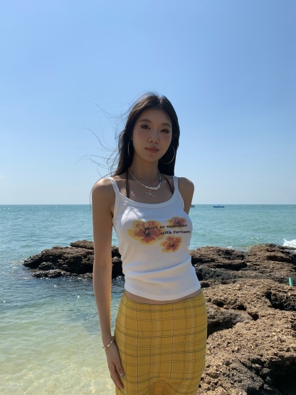 White spaghetti strap top with yellow flowers, bright style, perfect for summer