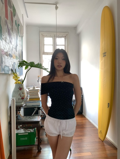Black one-shoulder crop top with polka dots