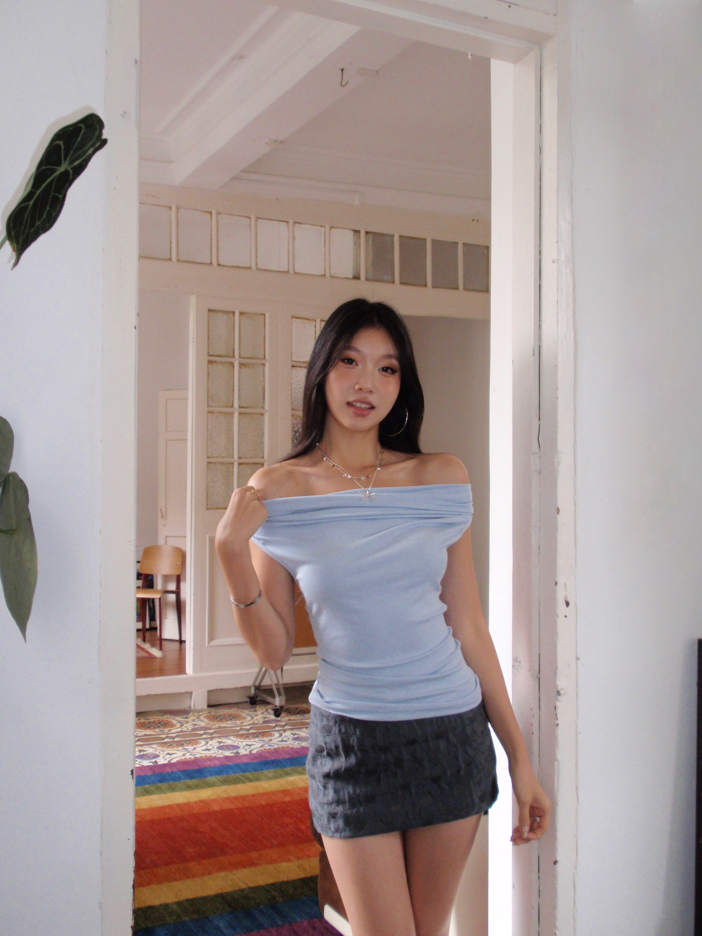 Dark grey low-waisted mini skirt with textured fabric