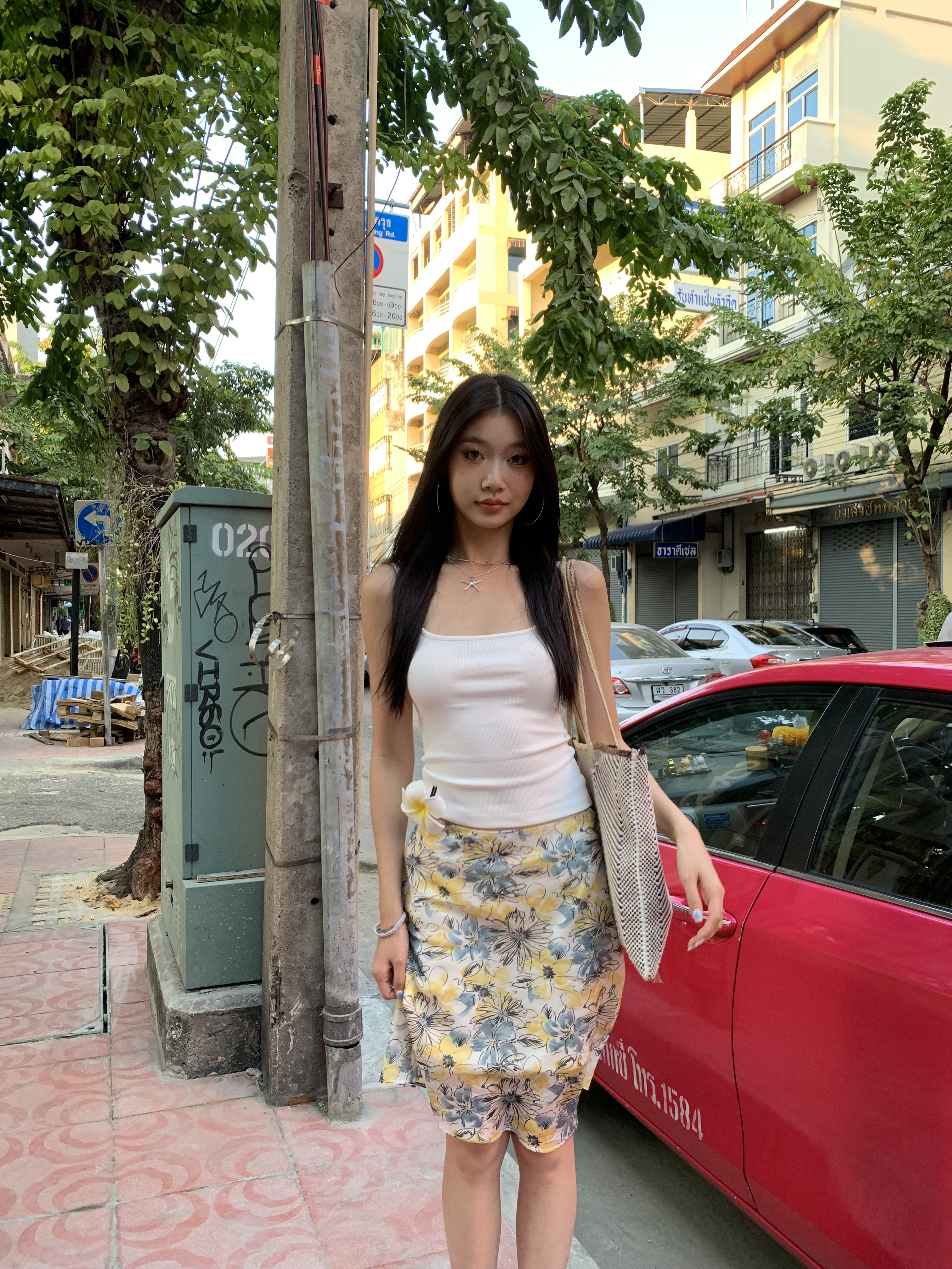 Mid-length skirt with ruffled edge design and multi-colored floral print