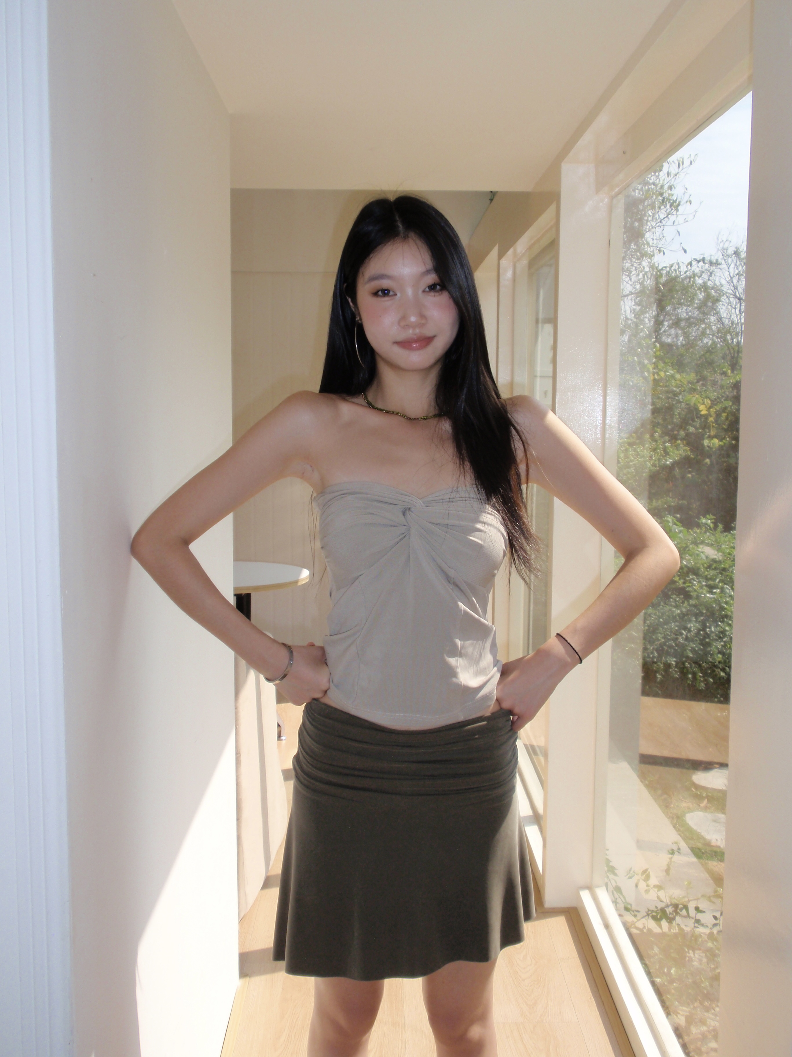Mid-length, fitted skirt with asymmetrical design.