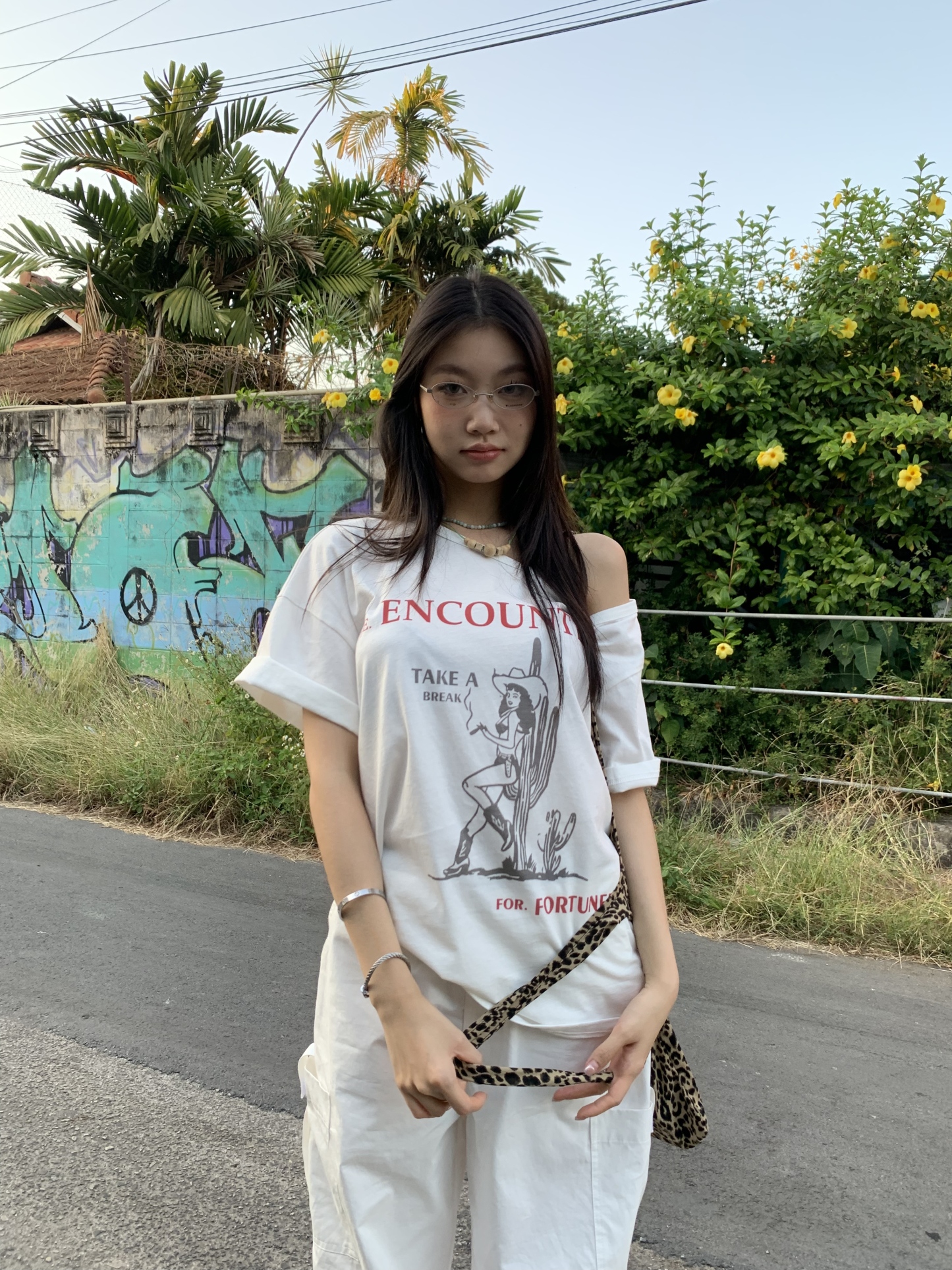 Off-shoulder design T-shirt with a denim cowboy print