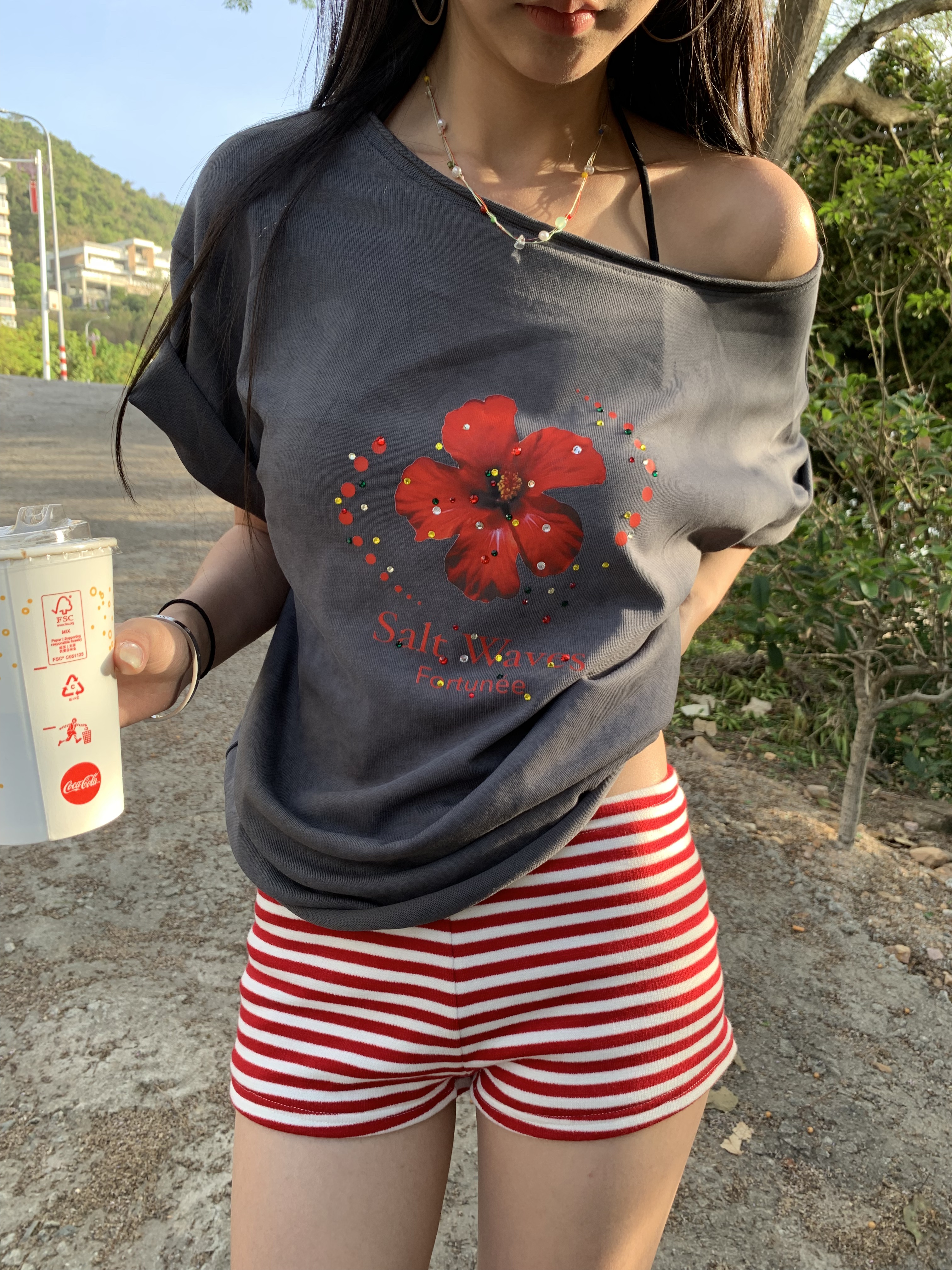 Loose fit hibiscus floral top with one shoulder cutouts