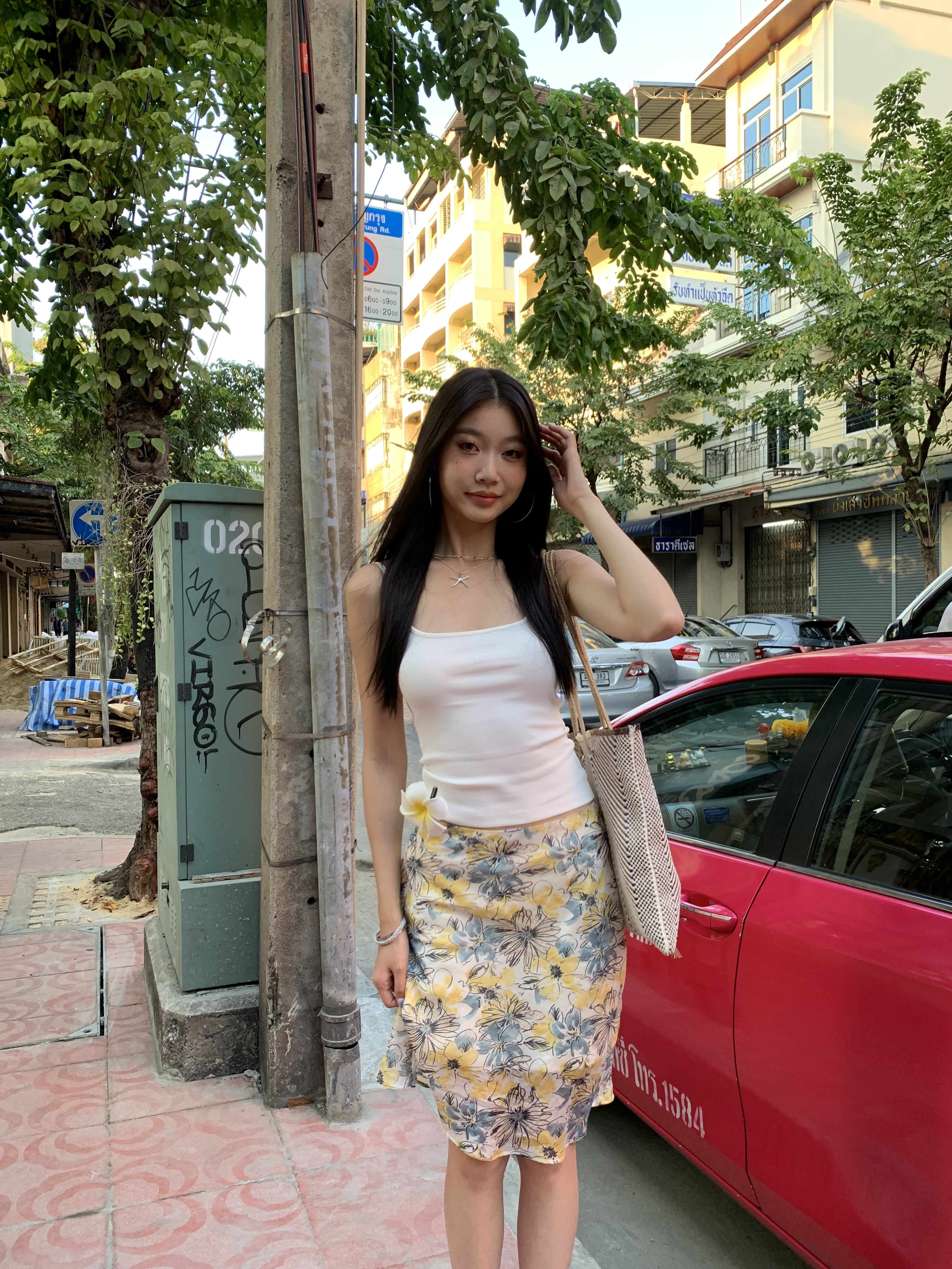 Mid-length skirt with ruffled edge design and multi-colored floral print