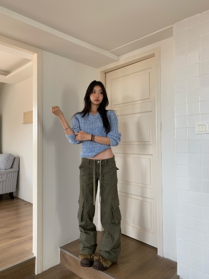 Vintage low-rise cargo pants with multiple pockets and a wide, straight leg.