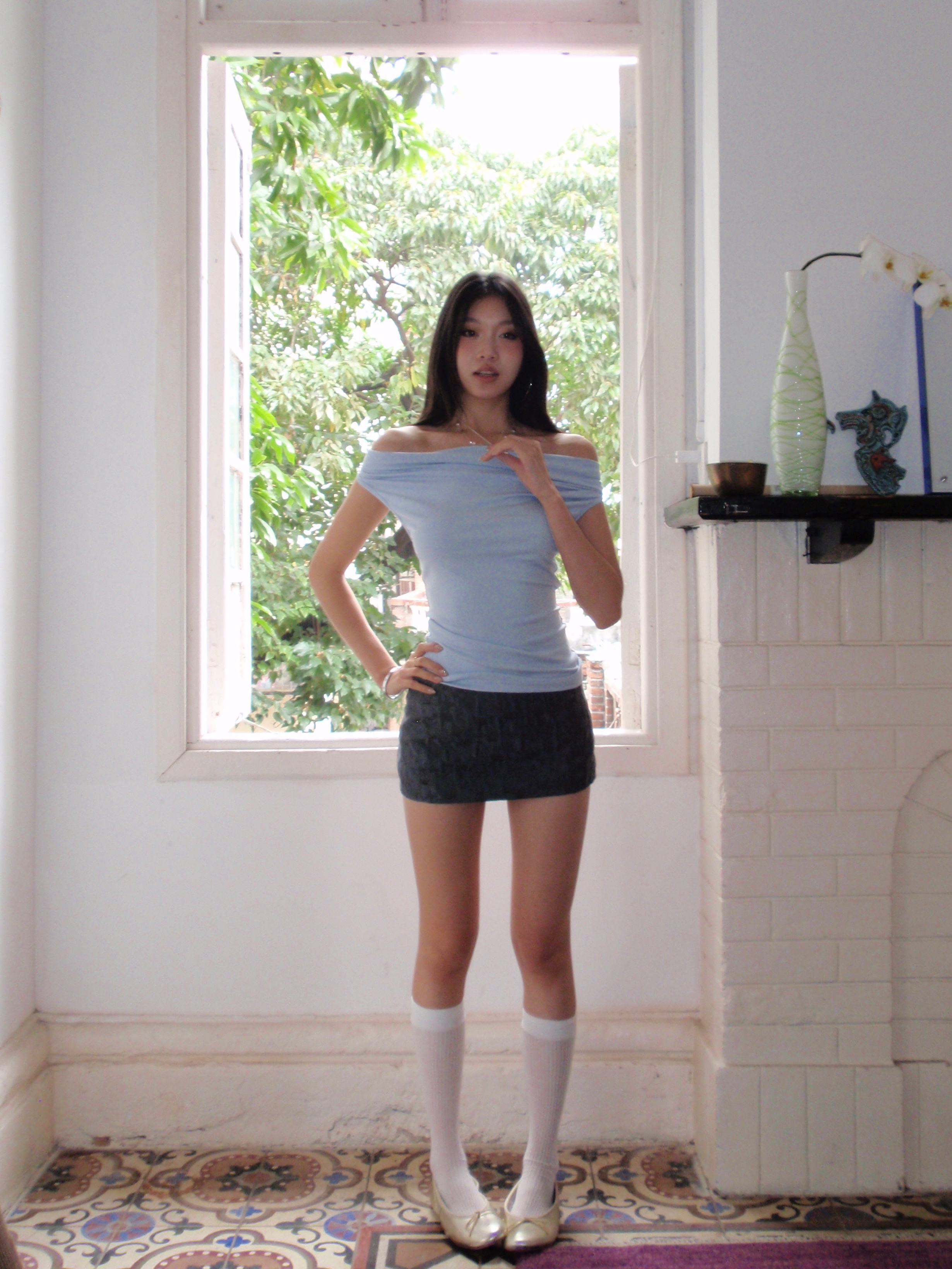 Dark grey low-waisted mini skirt with textured fabric