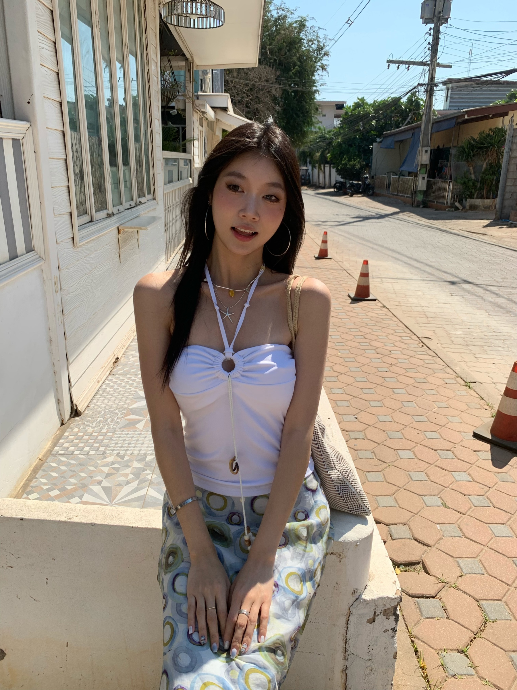 A fitted halter neck top that can be worn as a bra or on its own for a fresh summer look