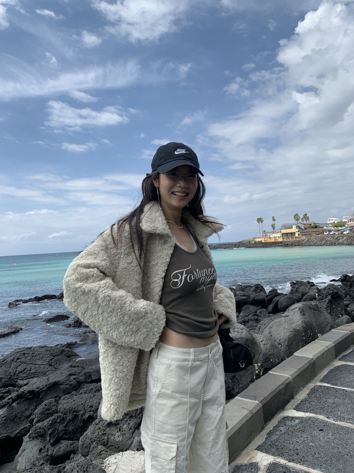 White warm cream American-style cargo pants with a slightly wide straight-leg fit and pockets