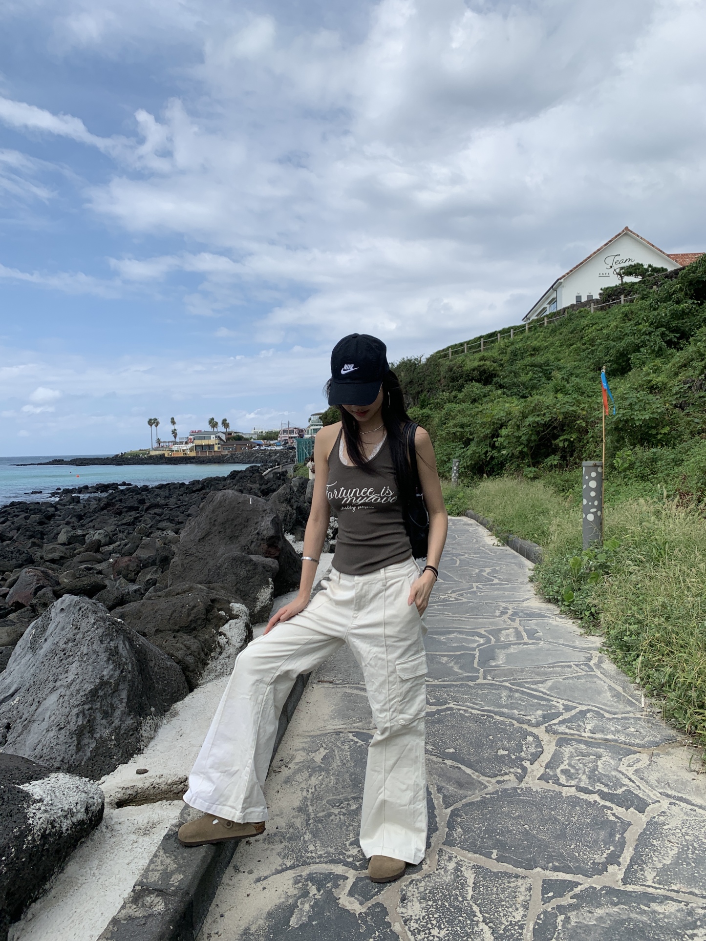 White warm cream American-style cargo pants with a slightly wide straight-leg fit and pockets