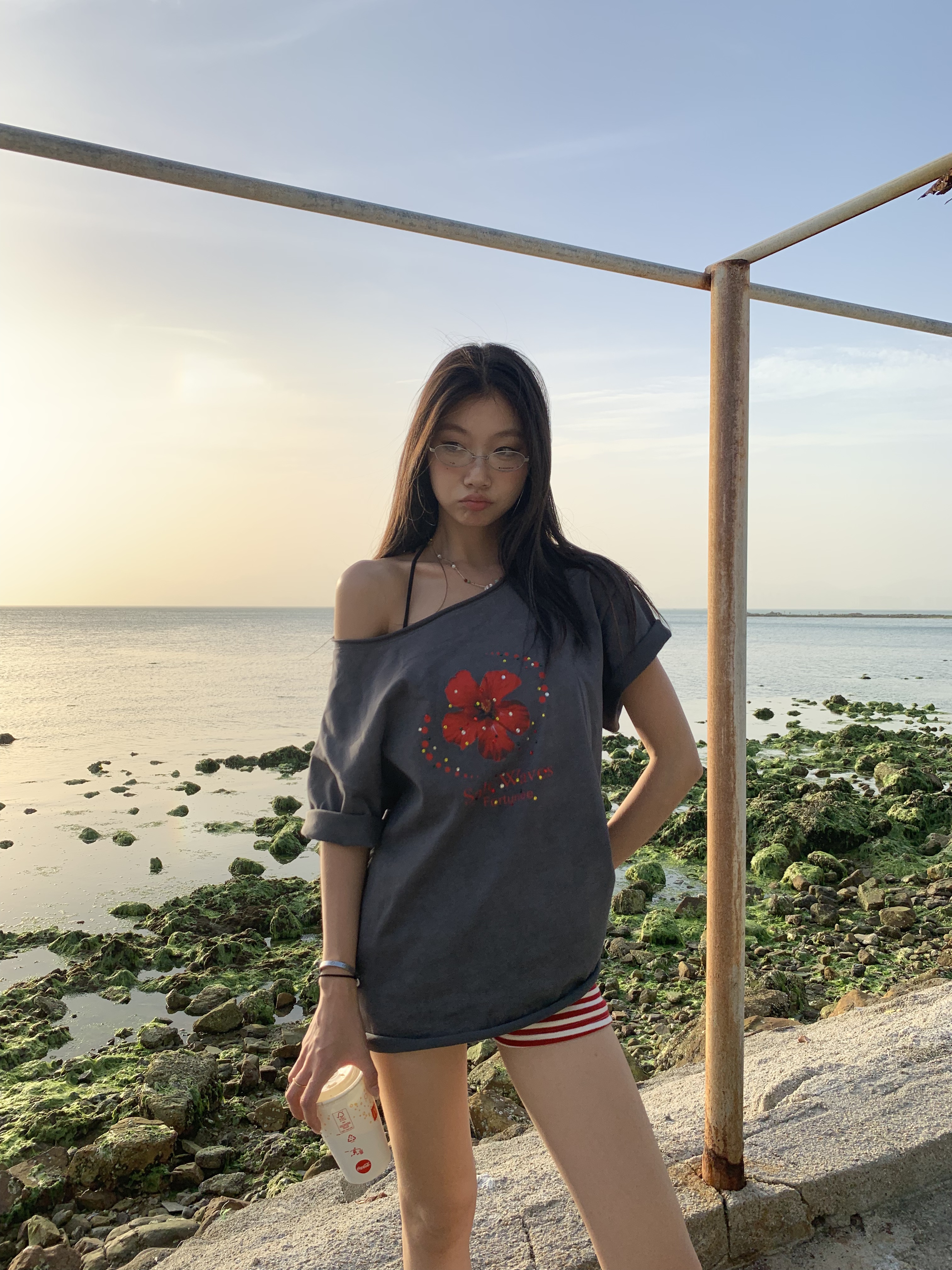 Loose fit hibiscus floral top with one shoulder cutouts