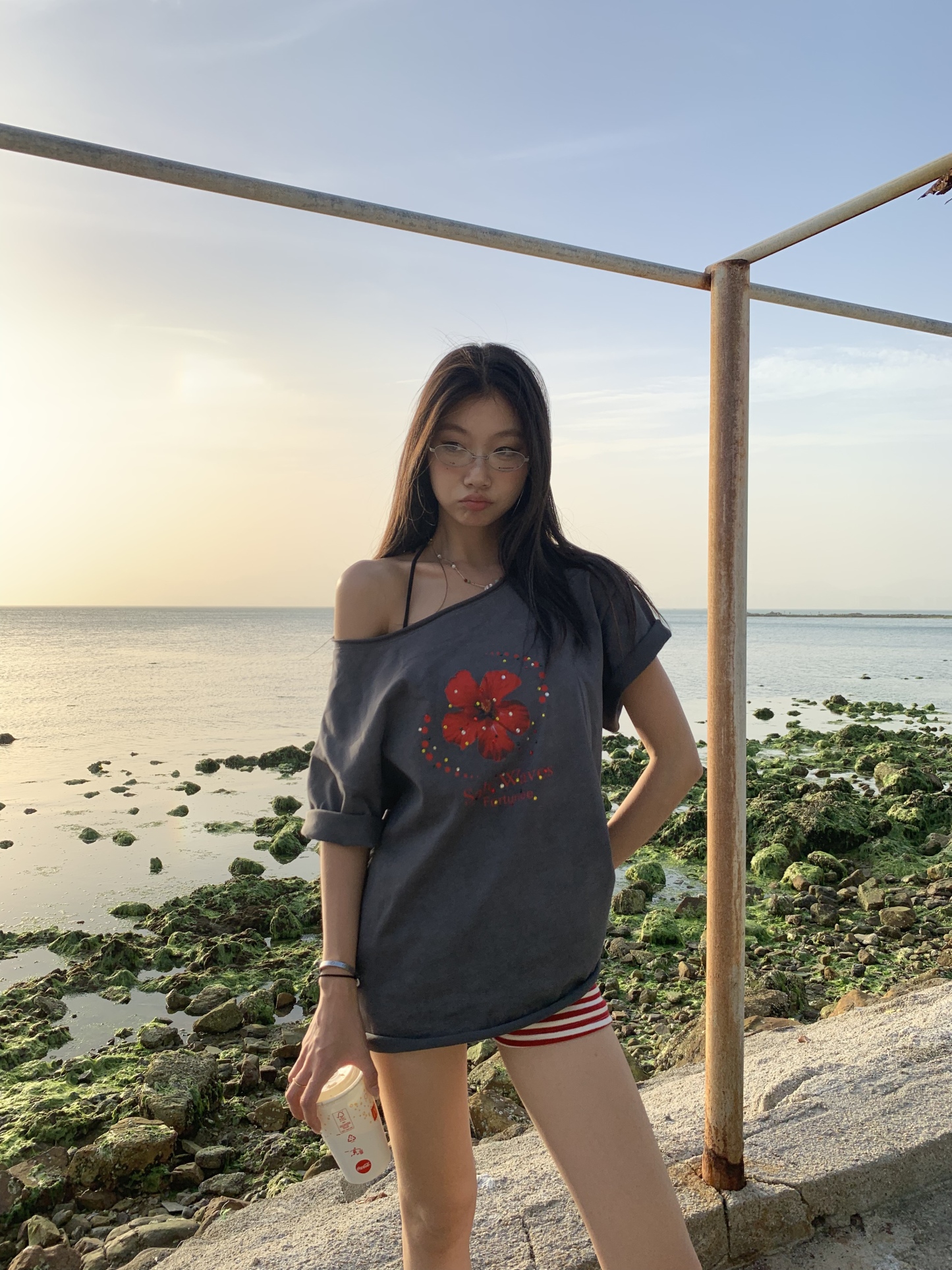 Loose fit hibiscus floral top with one shoulder cutouts