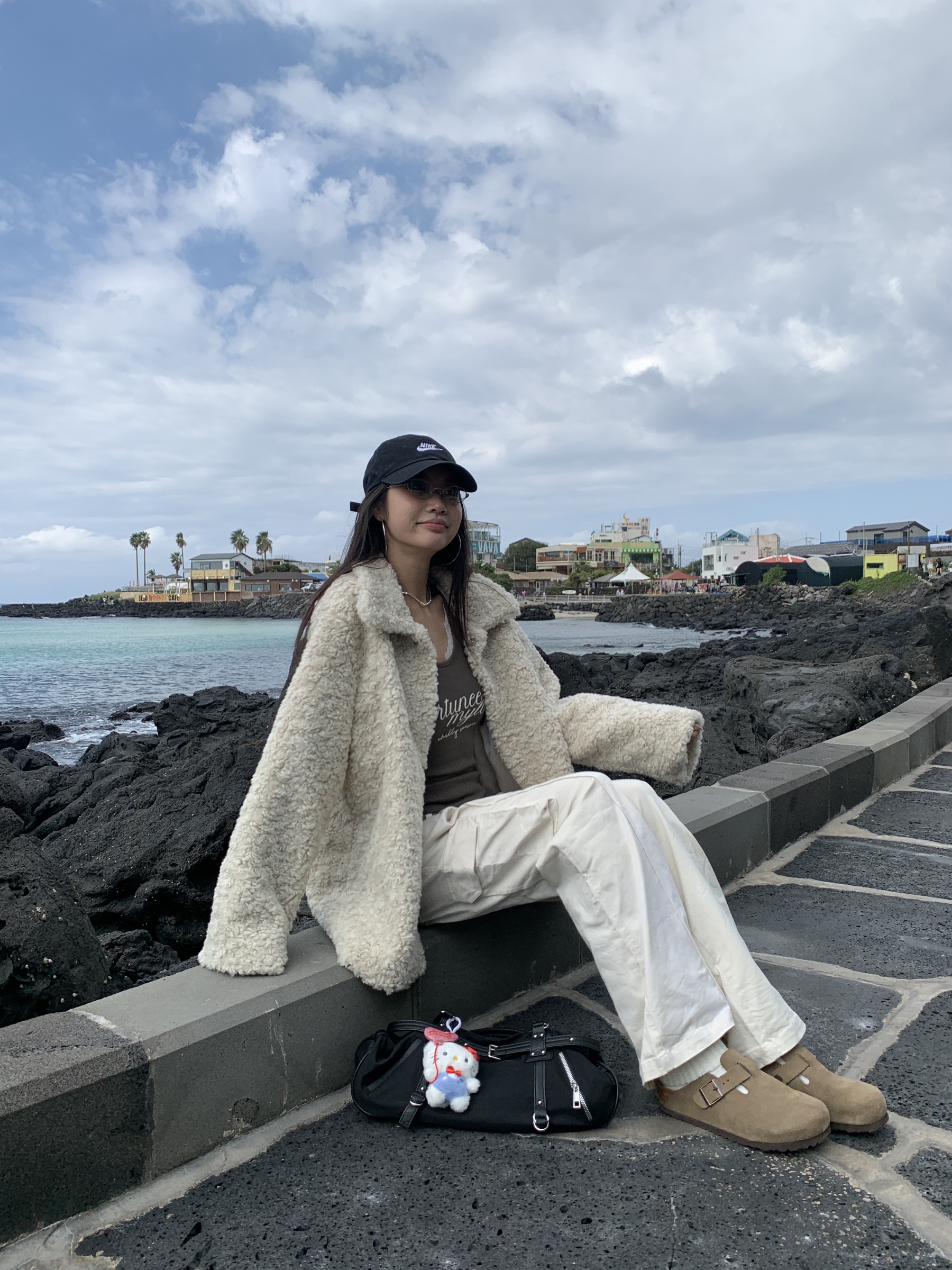 White warm cream American-style cargo pants with a slightly wide straight-leg fit and pockets