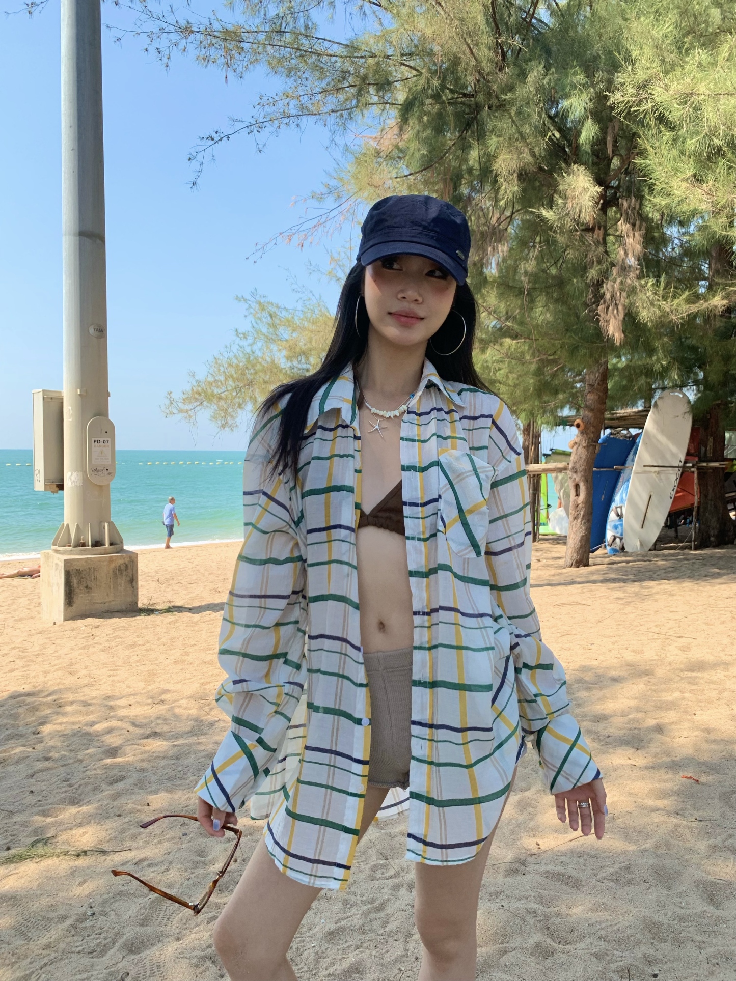 A colorful plaid shirt for summer. Lightweight fabric, loose long sleeves and sun protection.