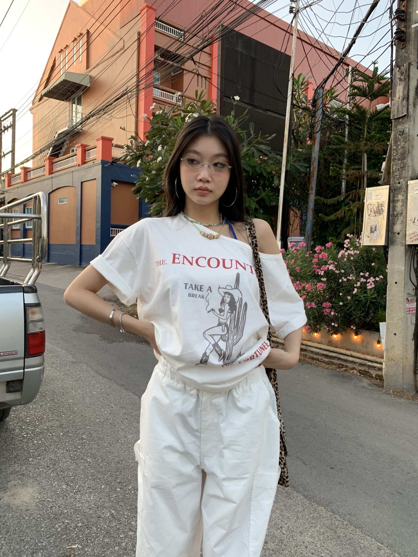 Off-shoulder design T-shirt with a denim cowboy print