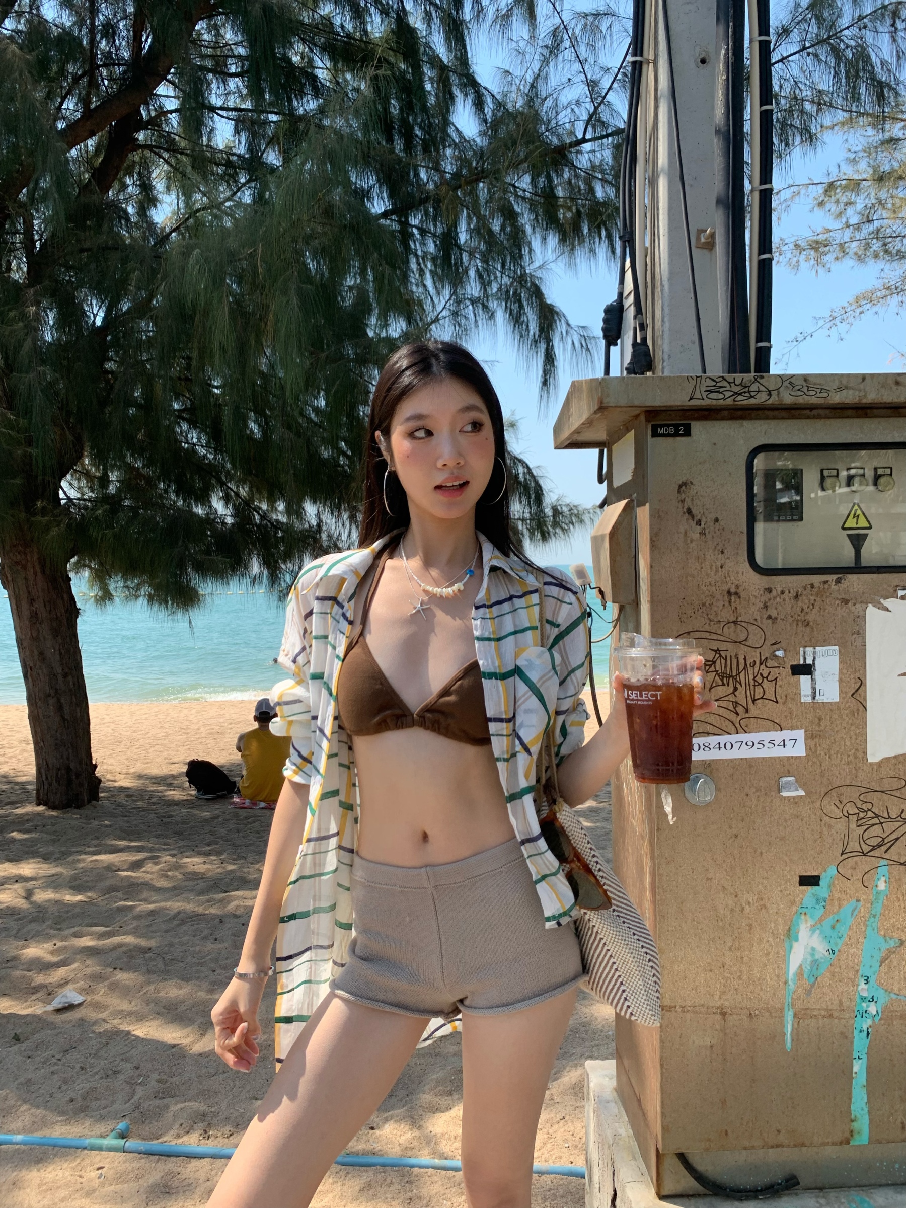 A colorful plaid shirt for summer. Lightweight fabric, loose long sleeves and sun protection.