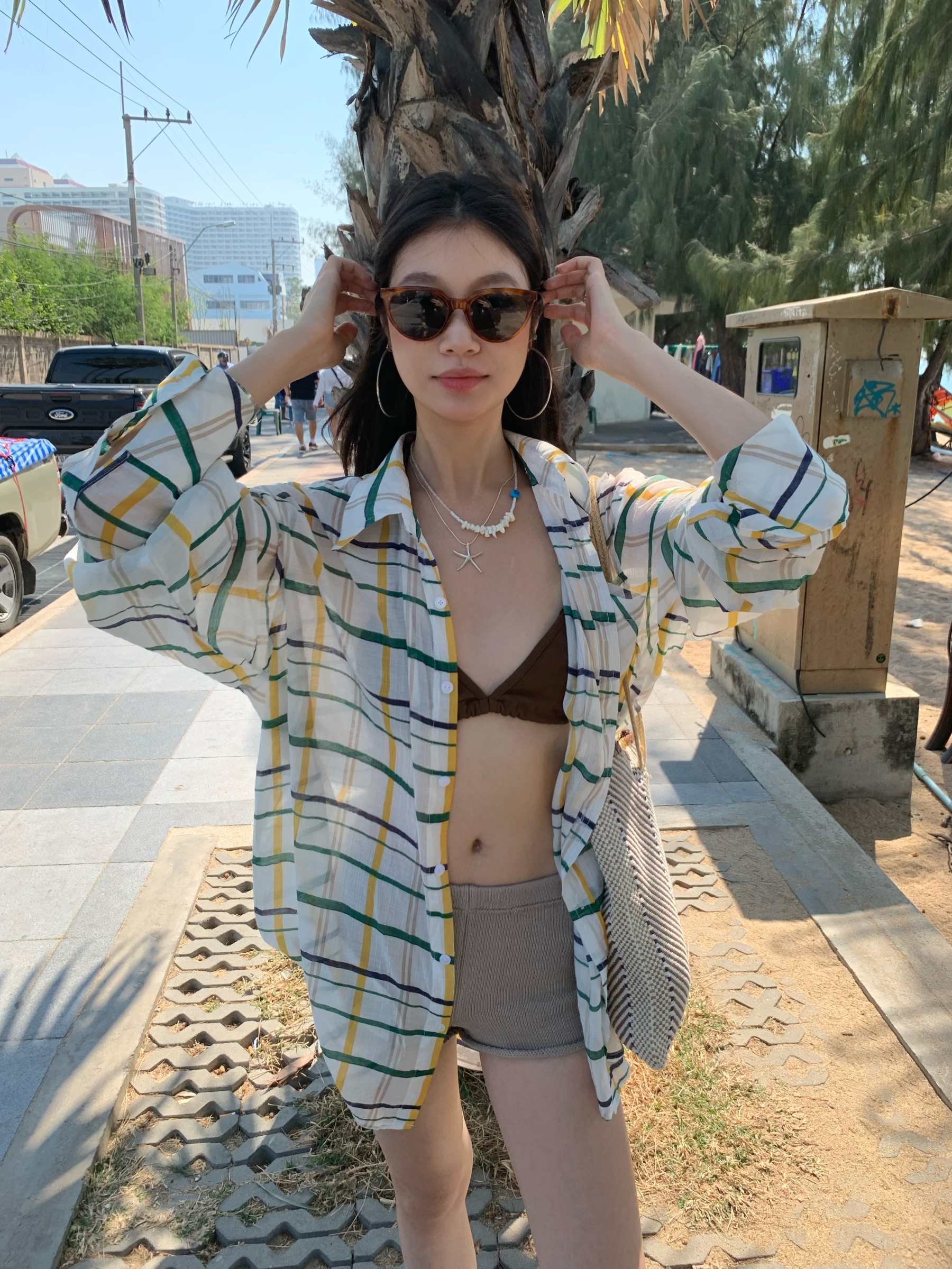 A colorful plaid shirt for summer. Lightweight fabric, loose long sleeves and sun protection.