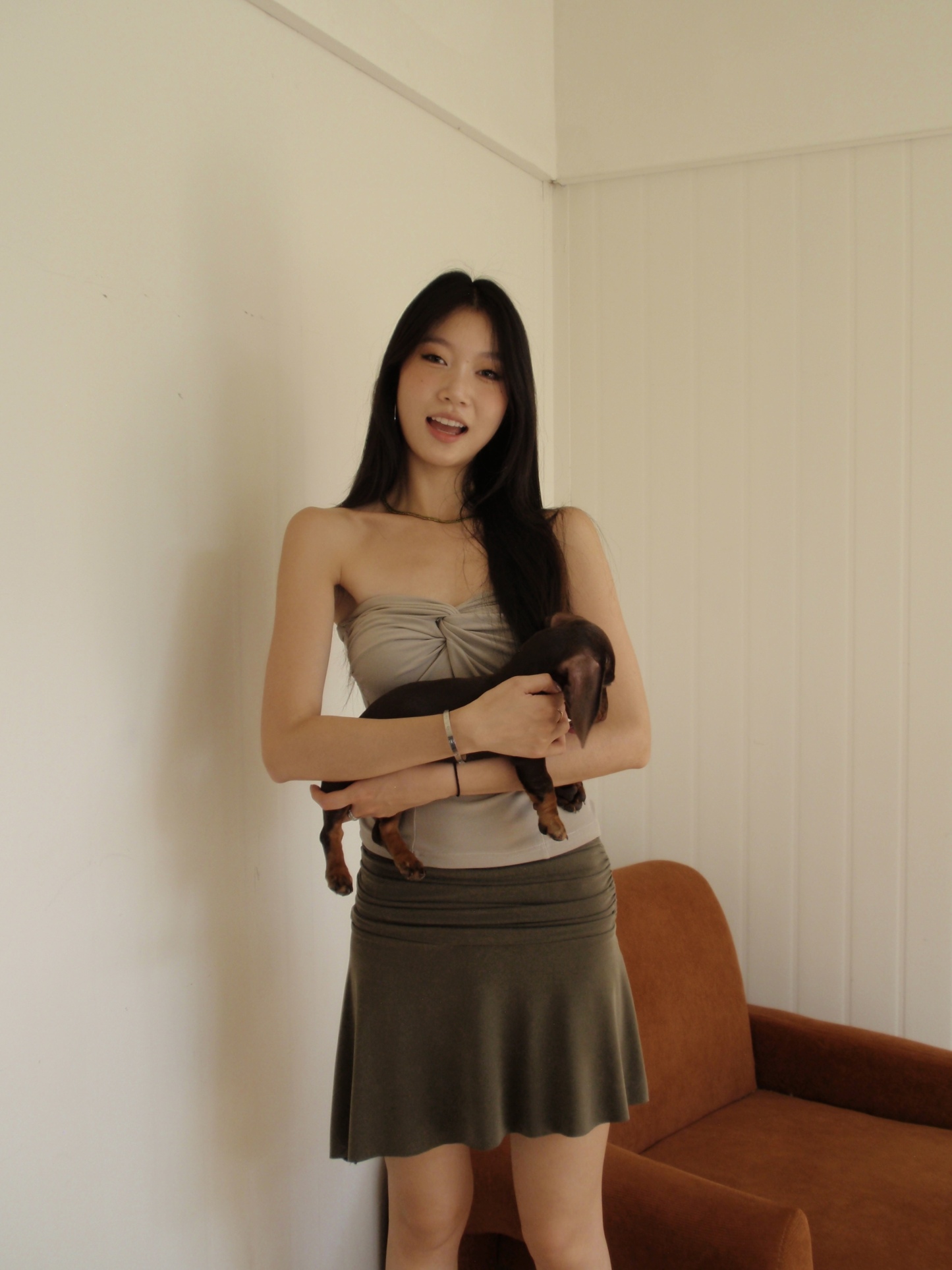 Mid-length, fitted skirt with asymmetrical design.