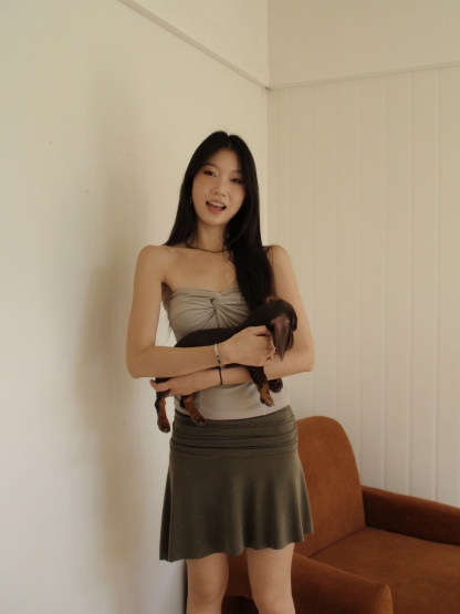 Mid-length, fitted skirt with asymmetrical design.