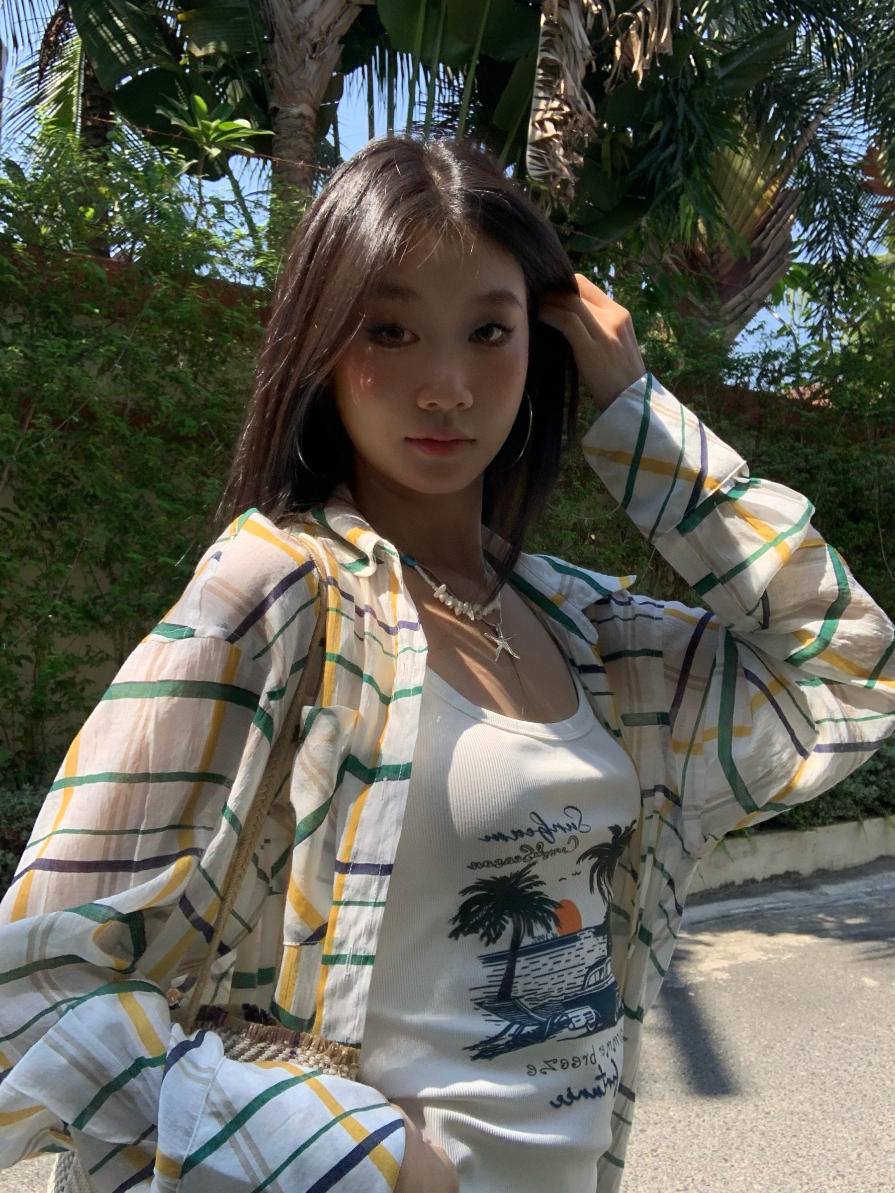 A colorful plaid shirt for summer. Lightweight fabric, loose long sleeves and sun protection.