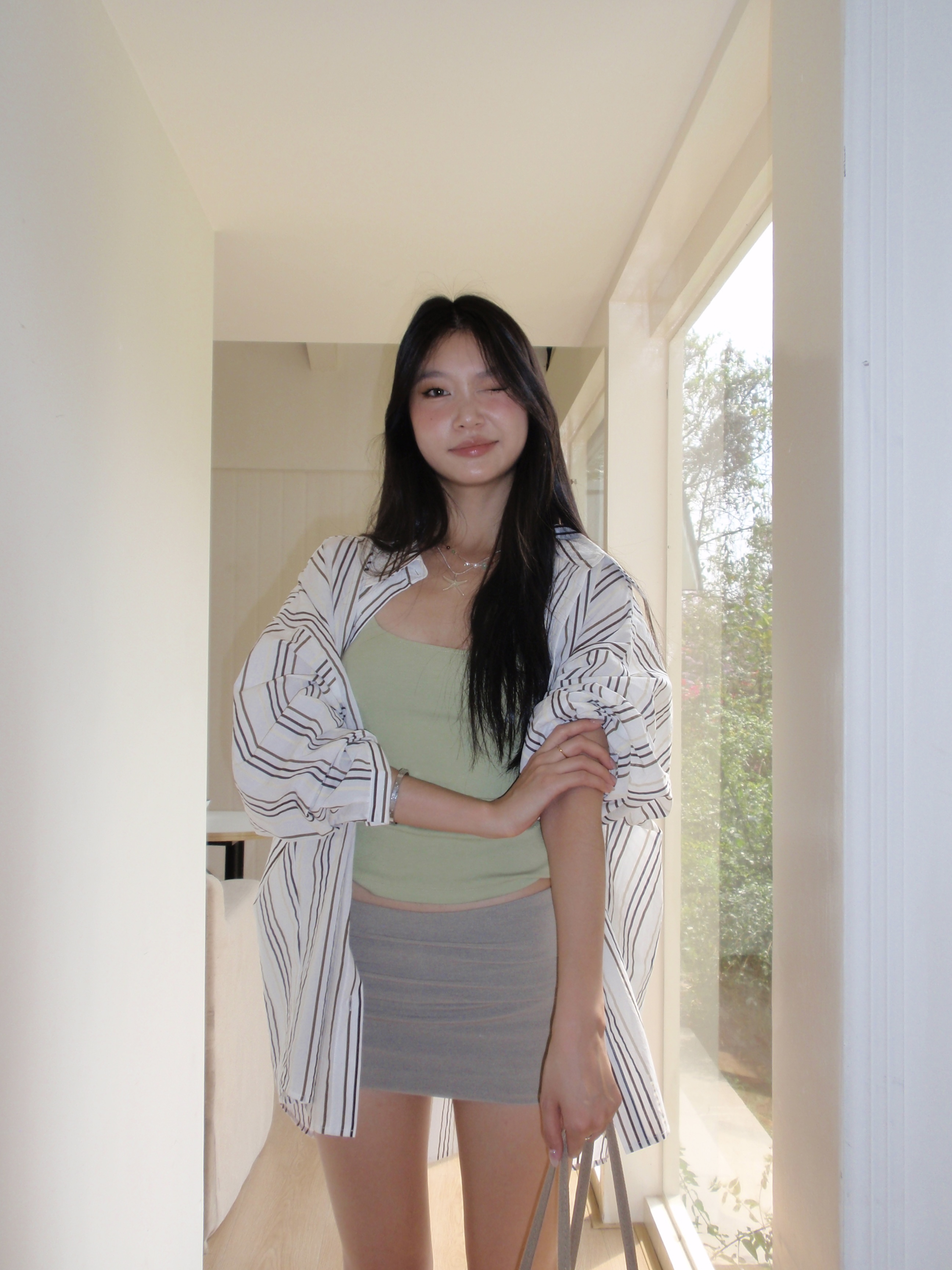 Green spaghetti strap top in a sexy style. Wear it as an inner shirt or wear it alone and it will look good.