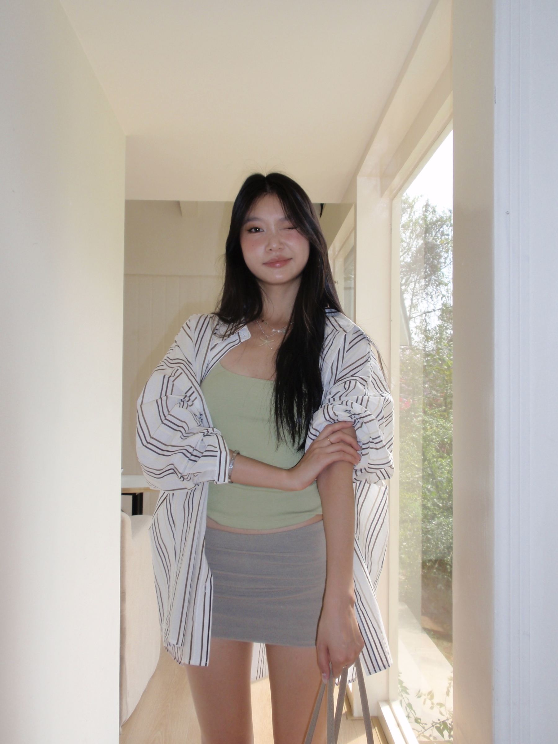 Green spaghetti strap top in a sexy style. Wear it as an inner shirt or wear it alone and it will look good.