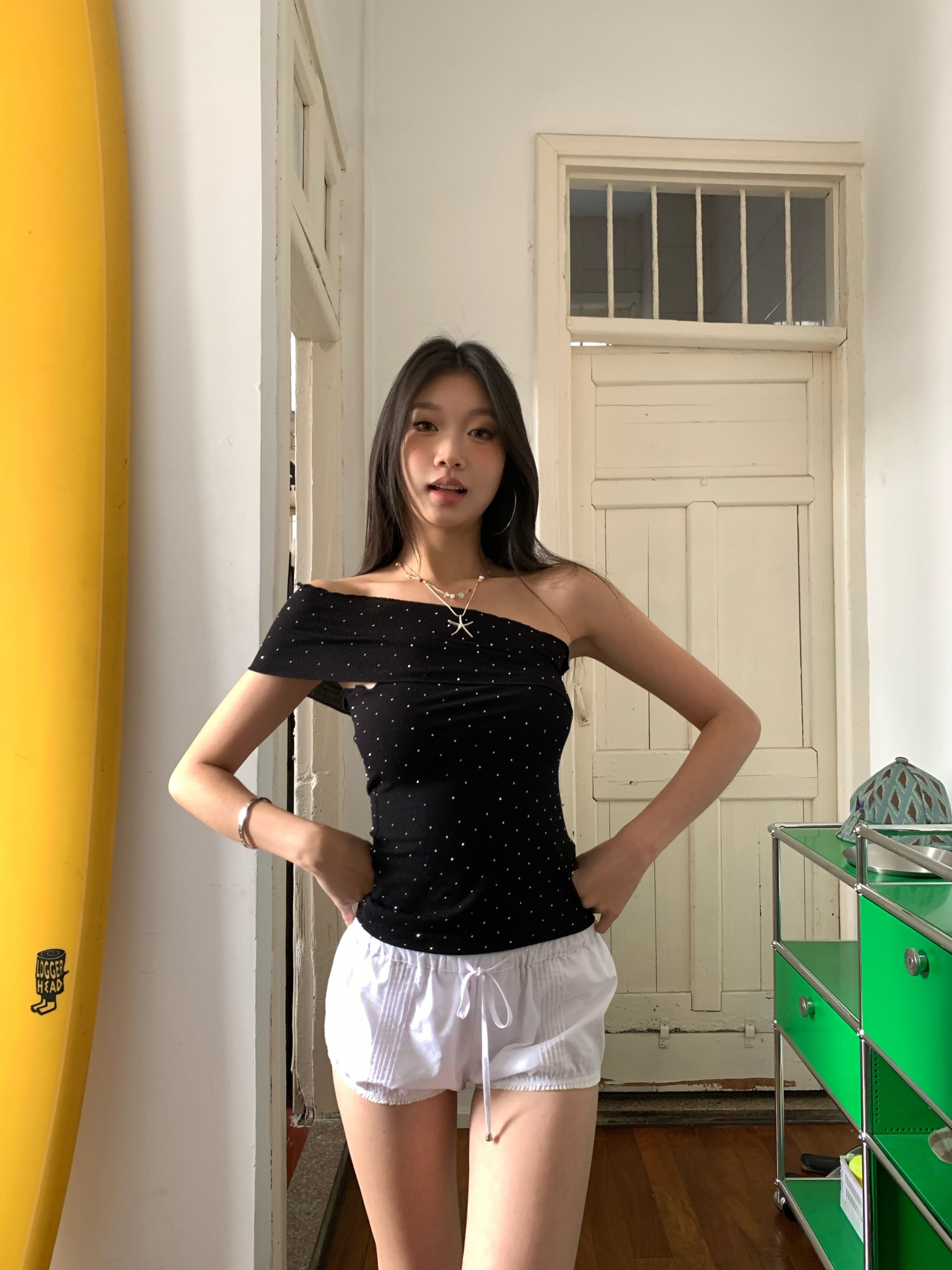 Black one-shoulder crop top with polka dots