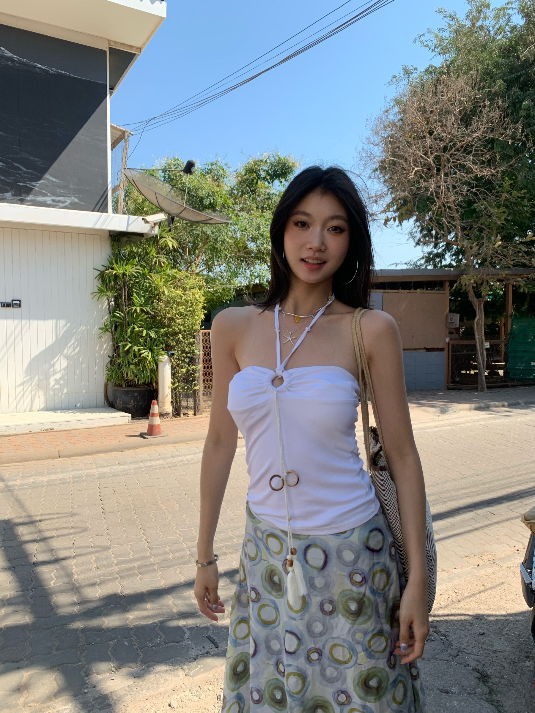 A fitted halter neck top that can be worn as a bra or on its own for a fresh summer look