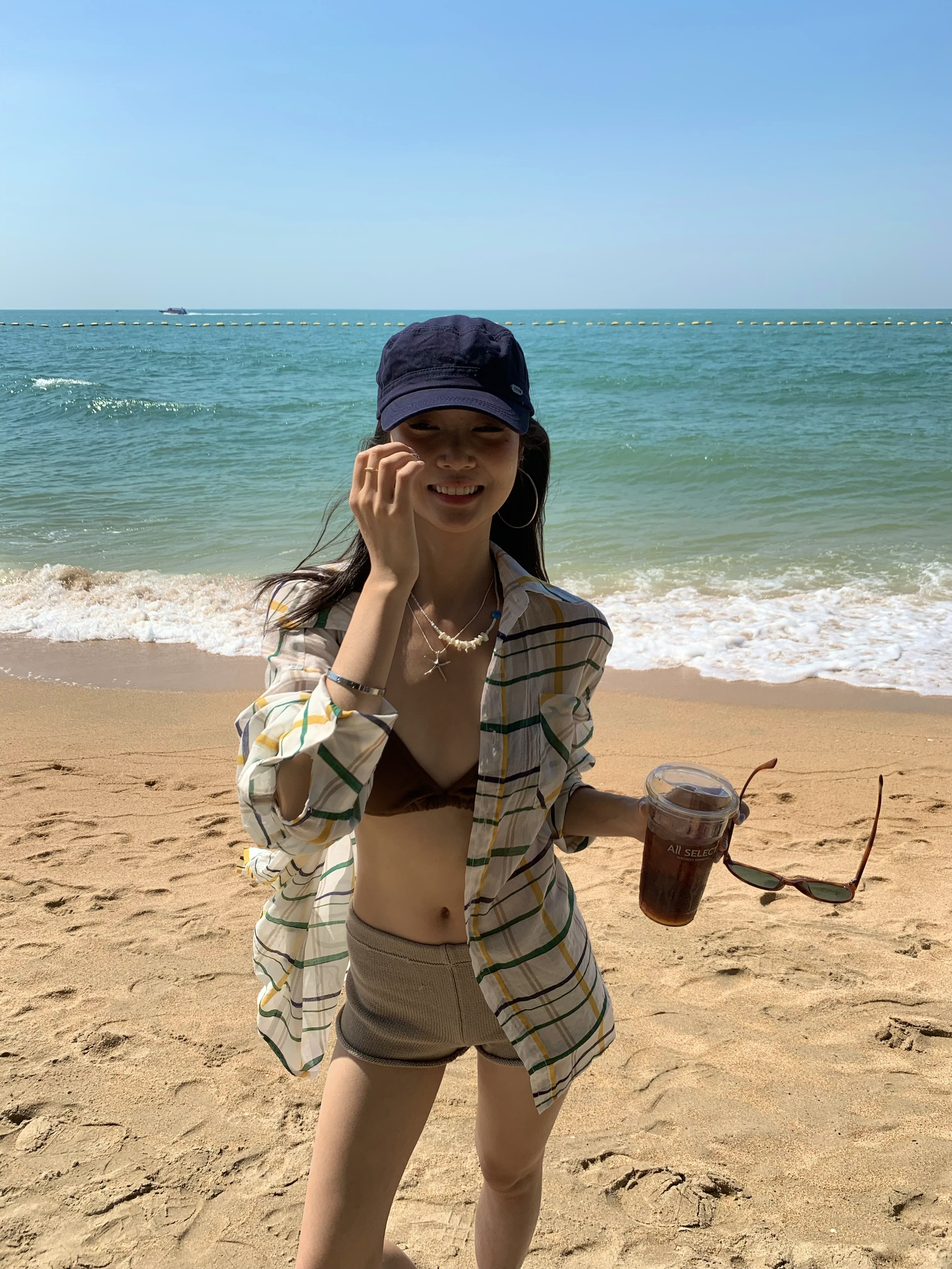 A colorful plaid shirt for summer. Lightweight fabric, loose long sleeves and sun protection.