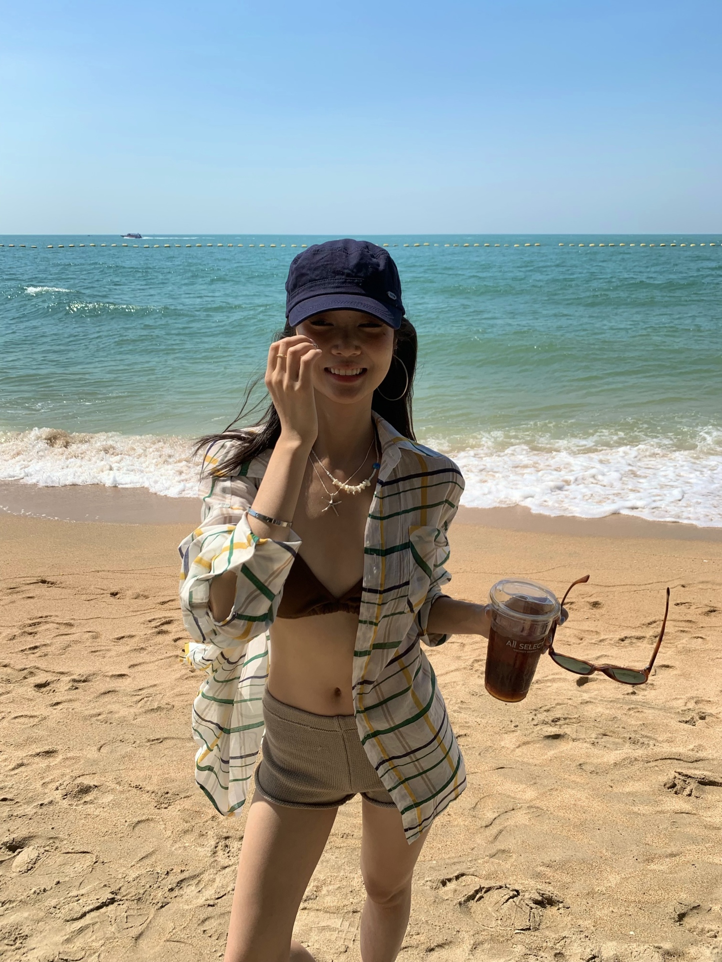 A colorful plaid shirt for summer. Lightweight fabric, loose long sleeves and sun protection.