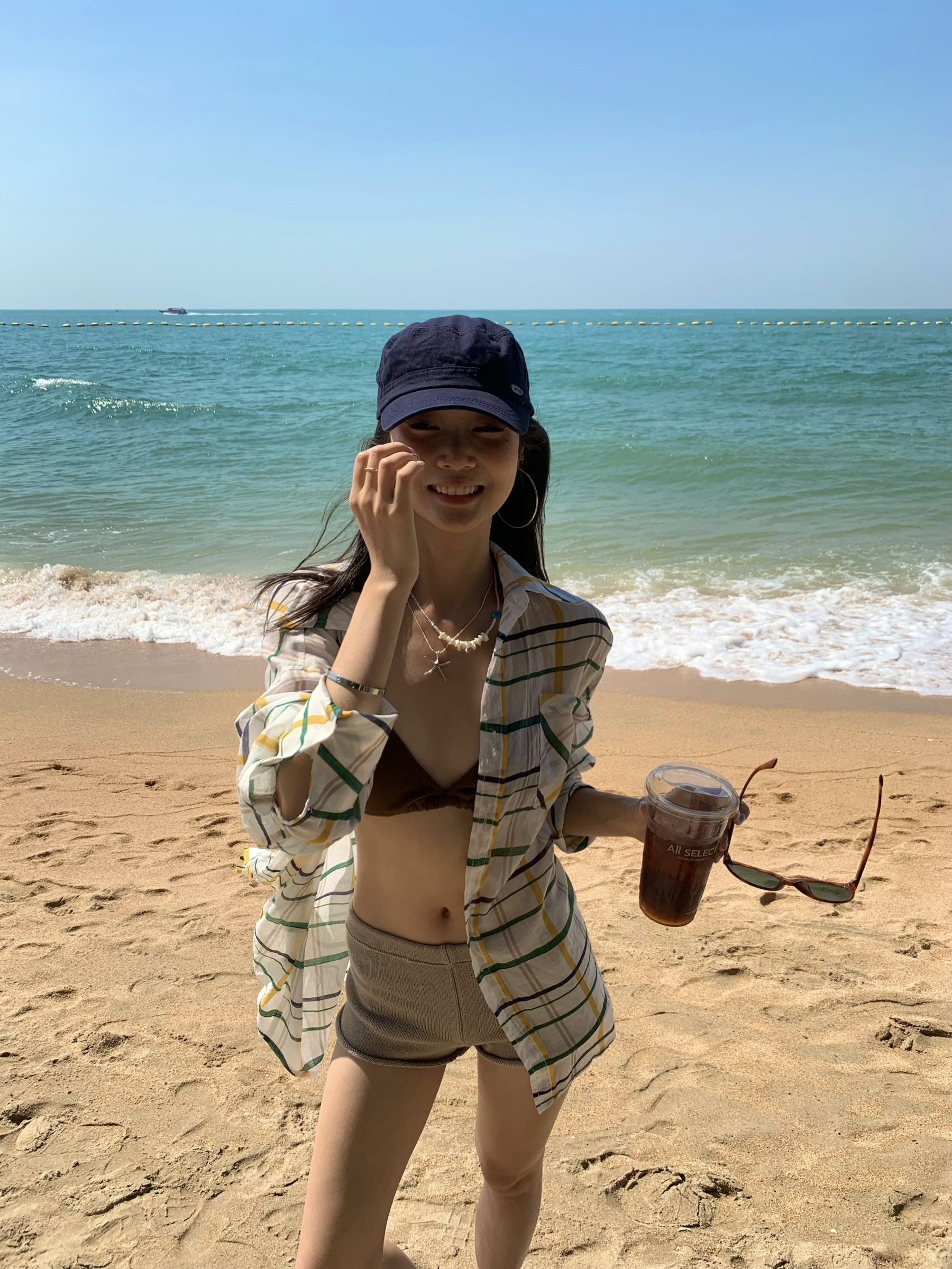 A colorful plaid shirt for summer. Lightweight fabric, loose long sleeves and sun protection.