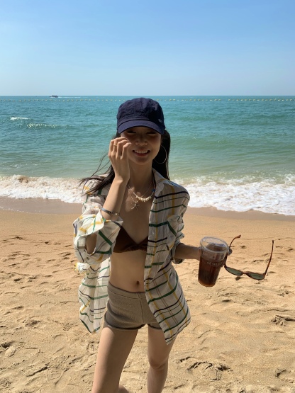 A colorful plaid shirt for summer. Lightweight fabric, loose long sleeves and sun protection.