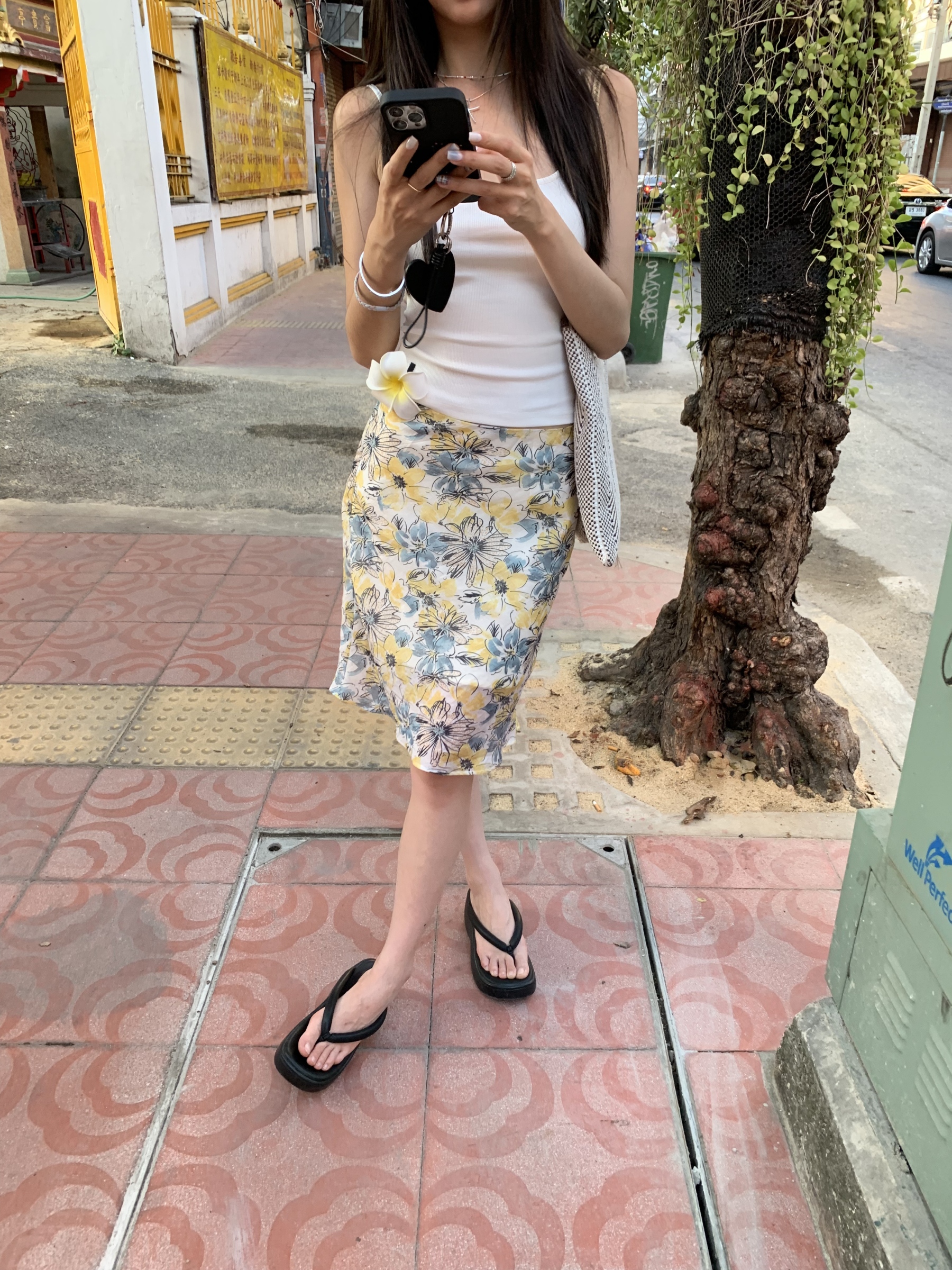 Mid-length skirt with ruffled edge design and multi-colored floral print