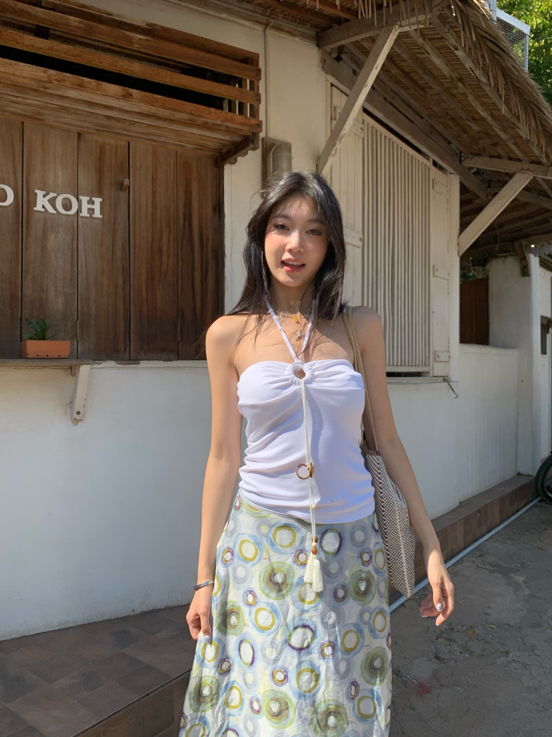 A fitted halter neck top that can be worn as a bra or on its own for a fresh summer look