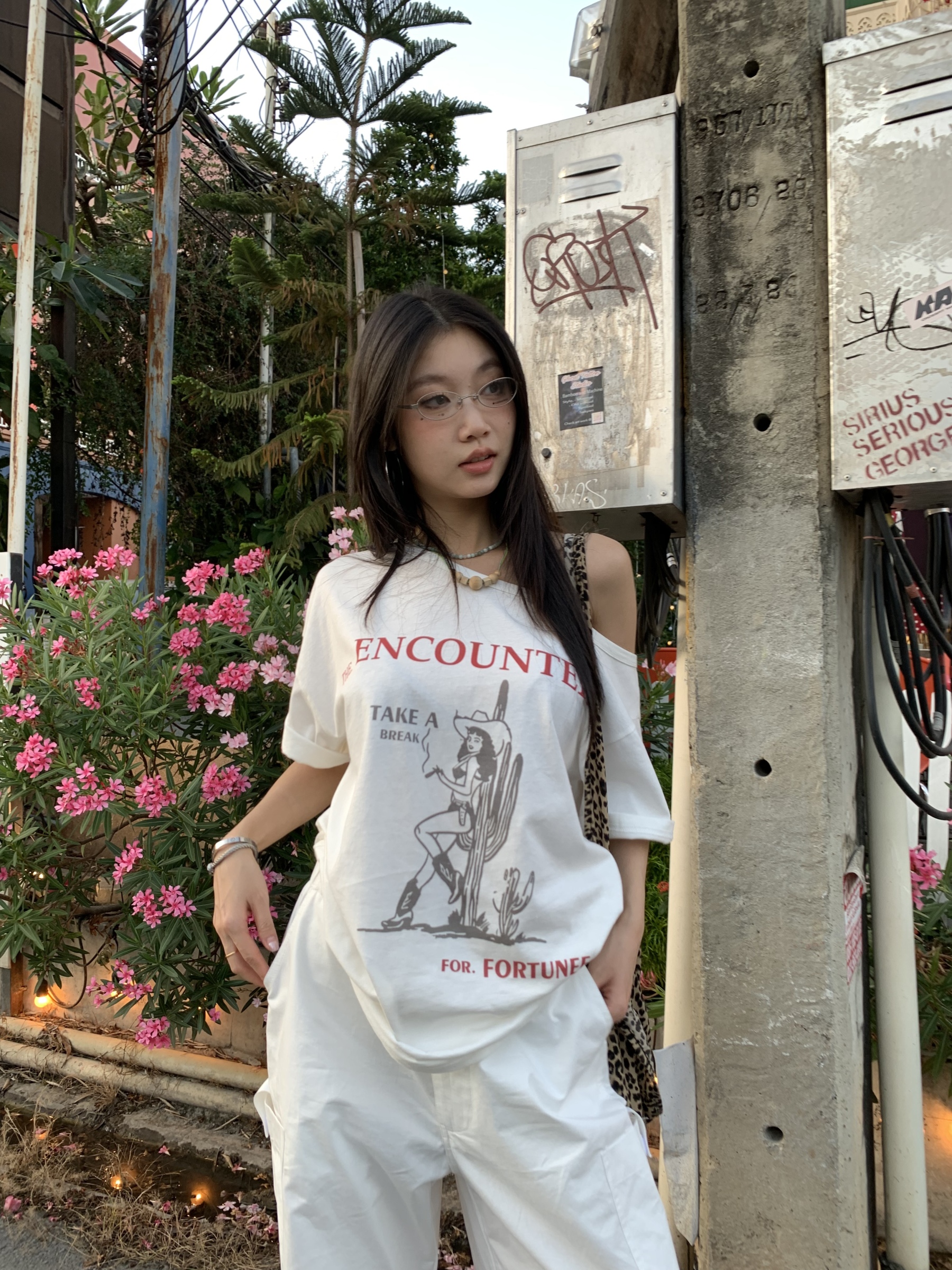 Off-shoulder design T-shirt with a denim cowboy print