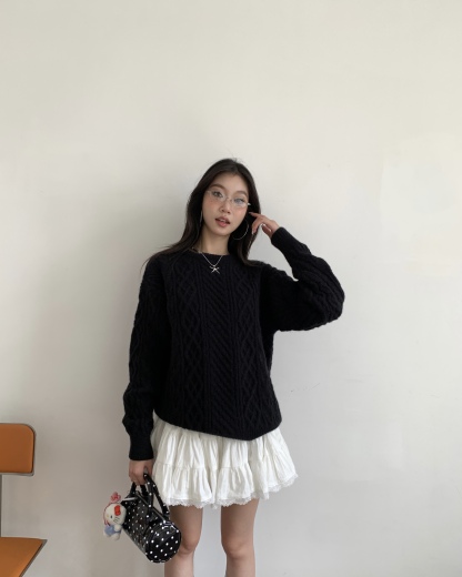 Women's knitted sweater with spiral pattern