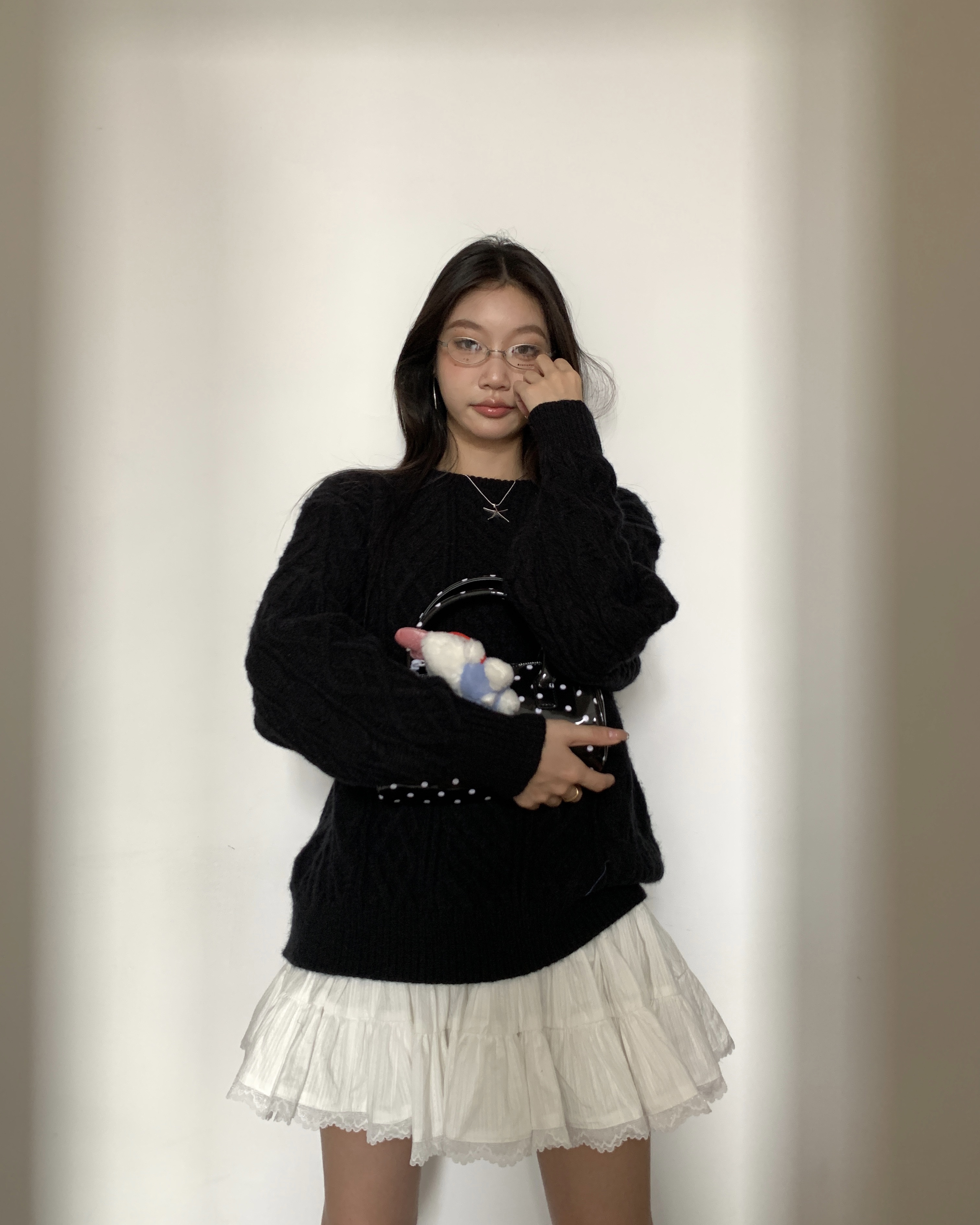 Women's knitted sweater with spiral pattern
