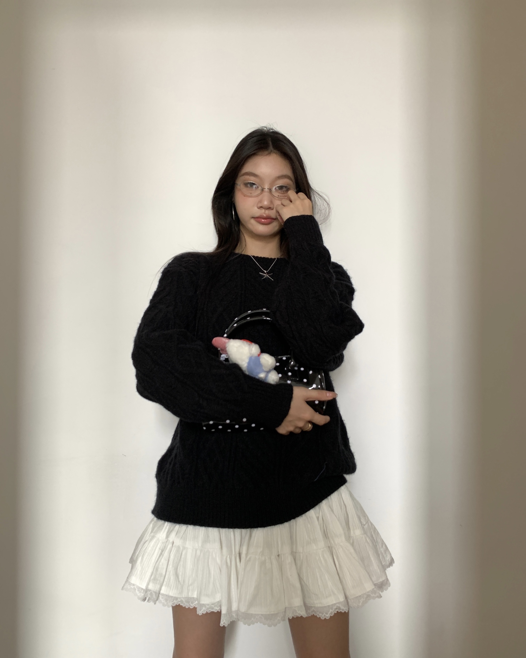 Women's knitted sweater with spiral pattern