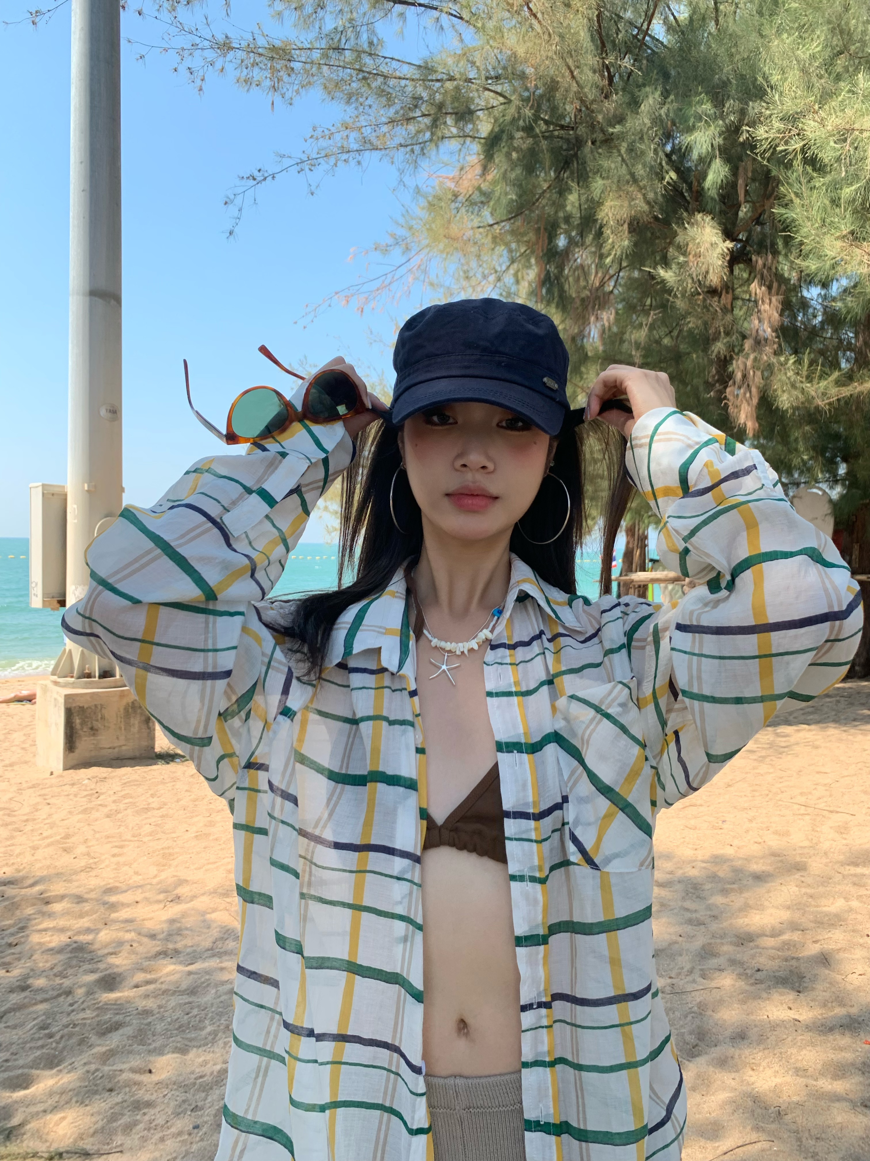 A colorful plaid shirt for summer. Lightweight fabric, loose long sleeves and sun protection.