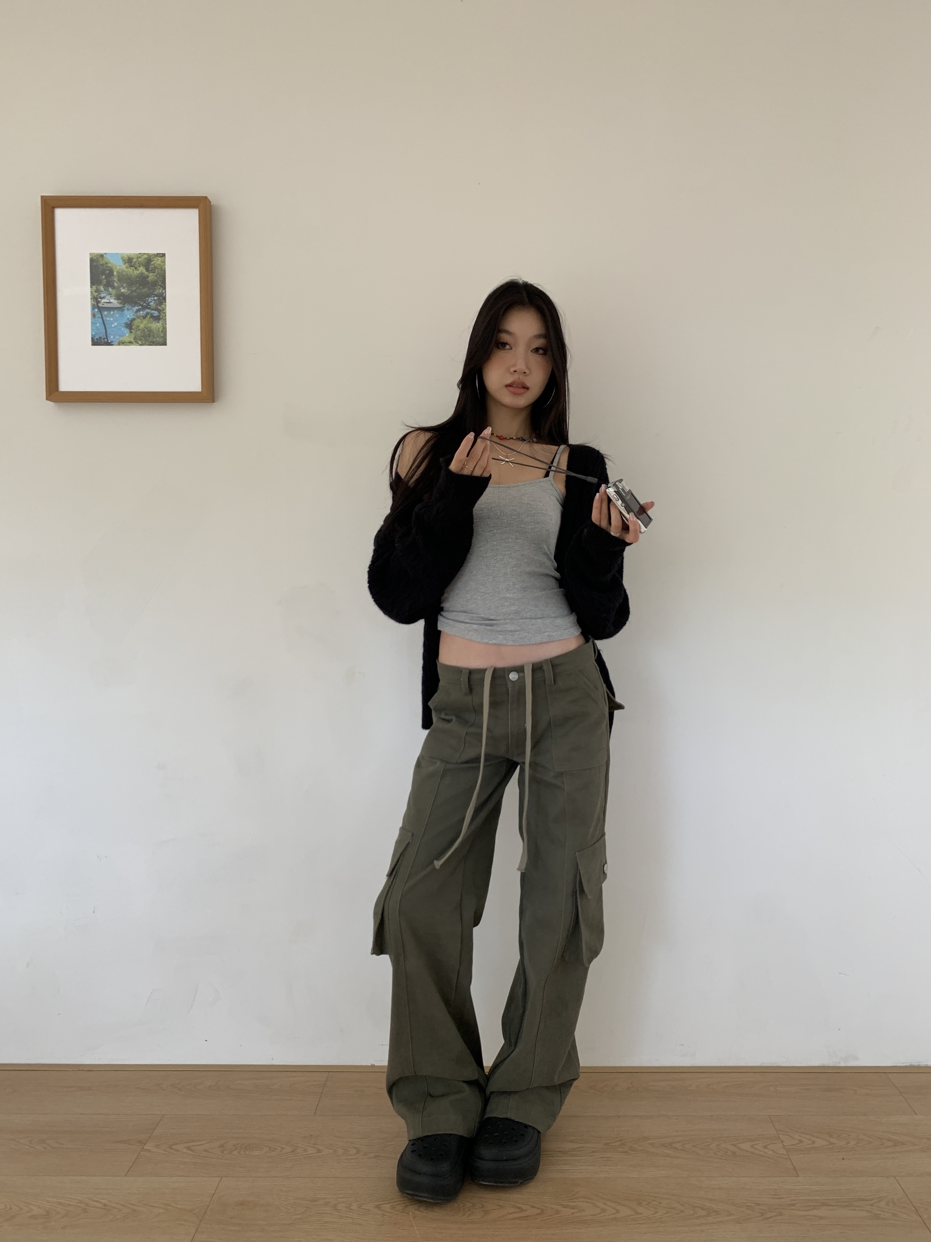 Vintage low-rise cargo pants with multiple pockets and a wide, straight leg.