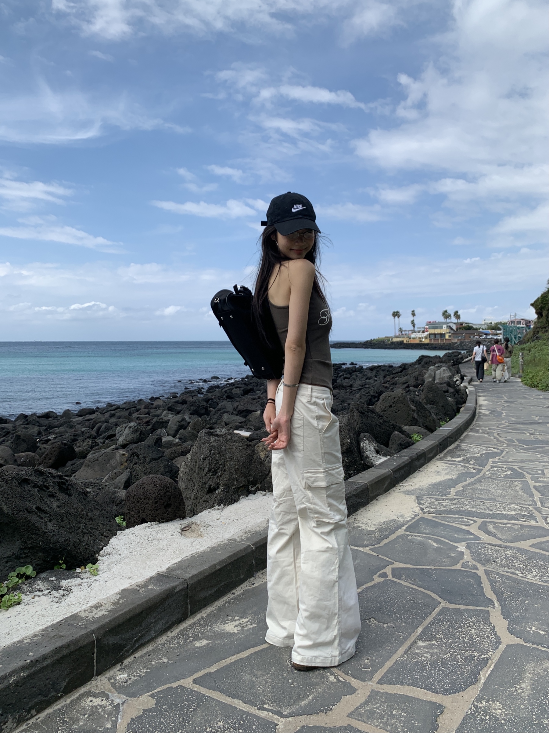 White warm cream American-style cargo pants with a slightly wide straight-leg fit and pockets