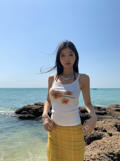 White spaghetti strap top with yellow flowers, bright style, perfect for summer