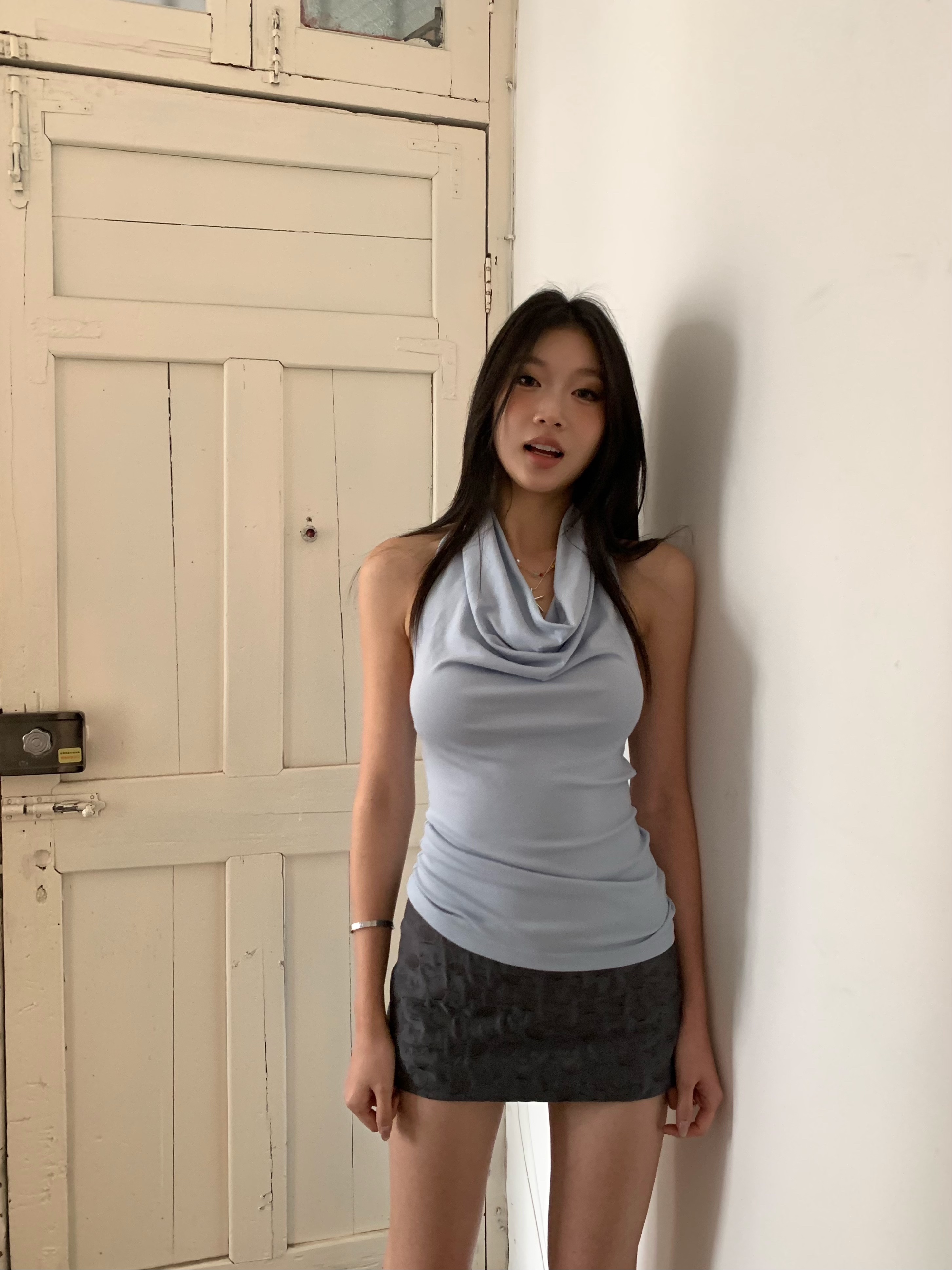 Dark grey low-waisted mini skirt with textured fabric