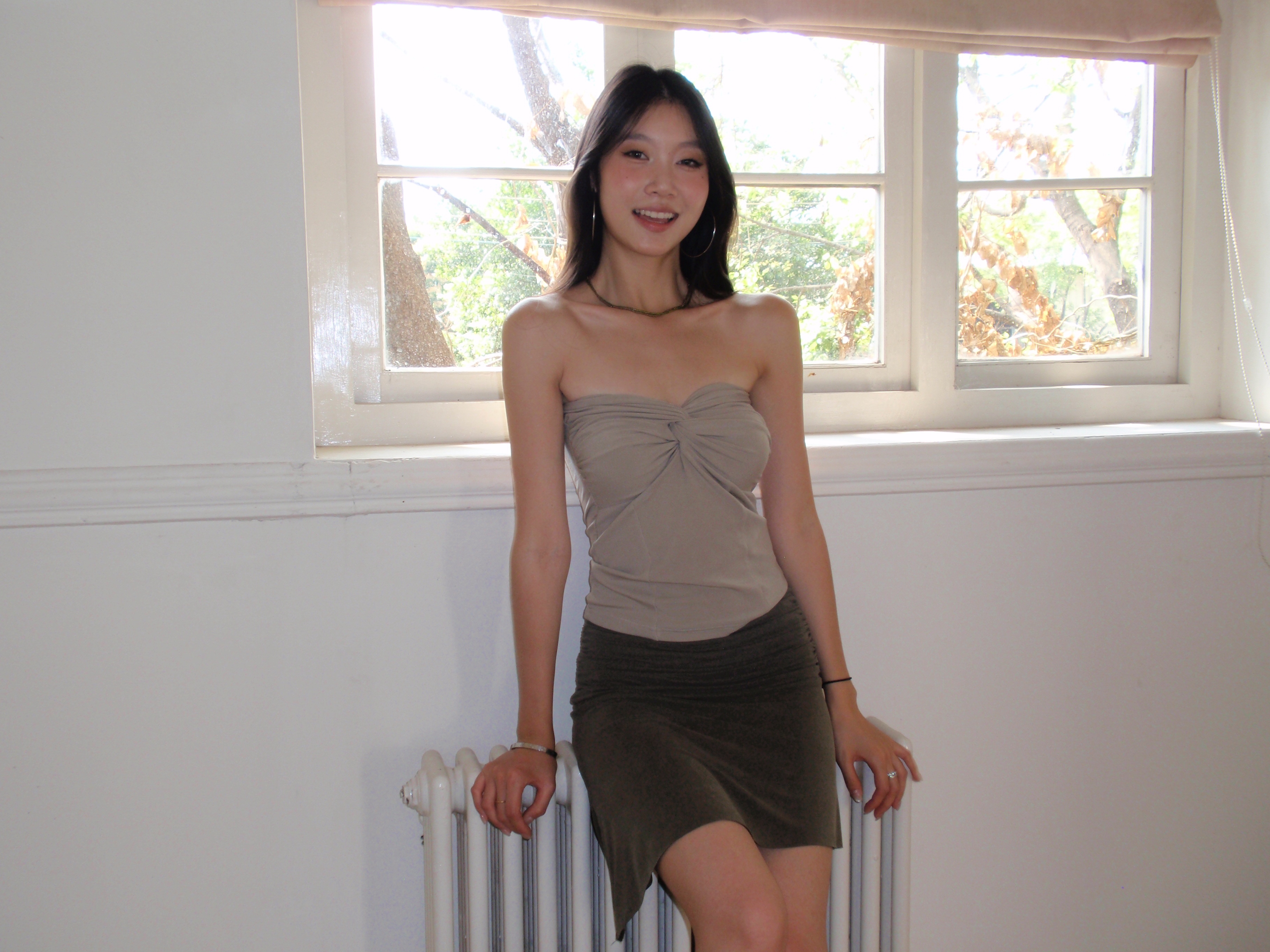 Mid-length, fitted skirt with asymmetrical design.