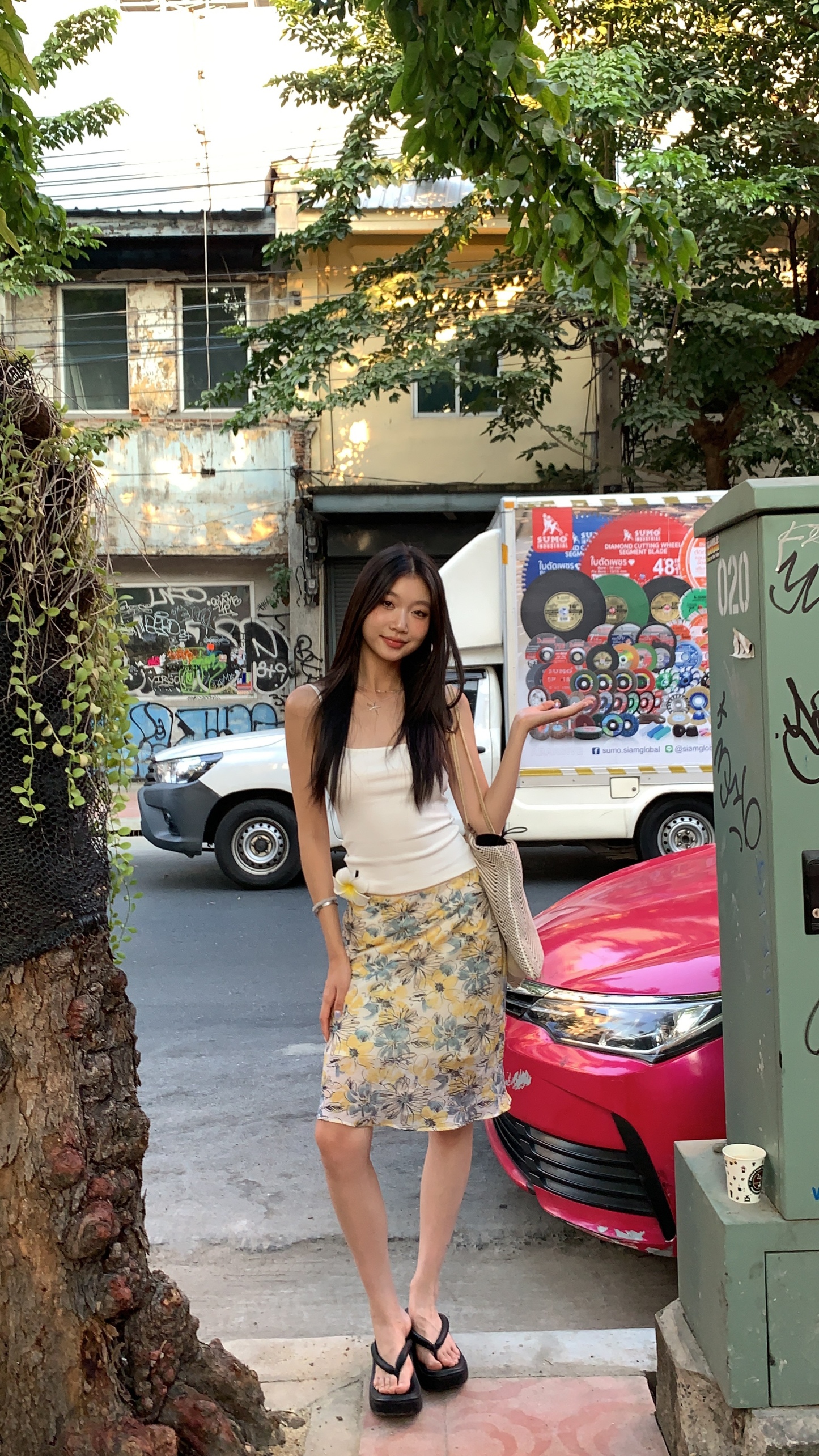 Mid-length skirt with ruffled edge design and multi-colored floral print