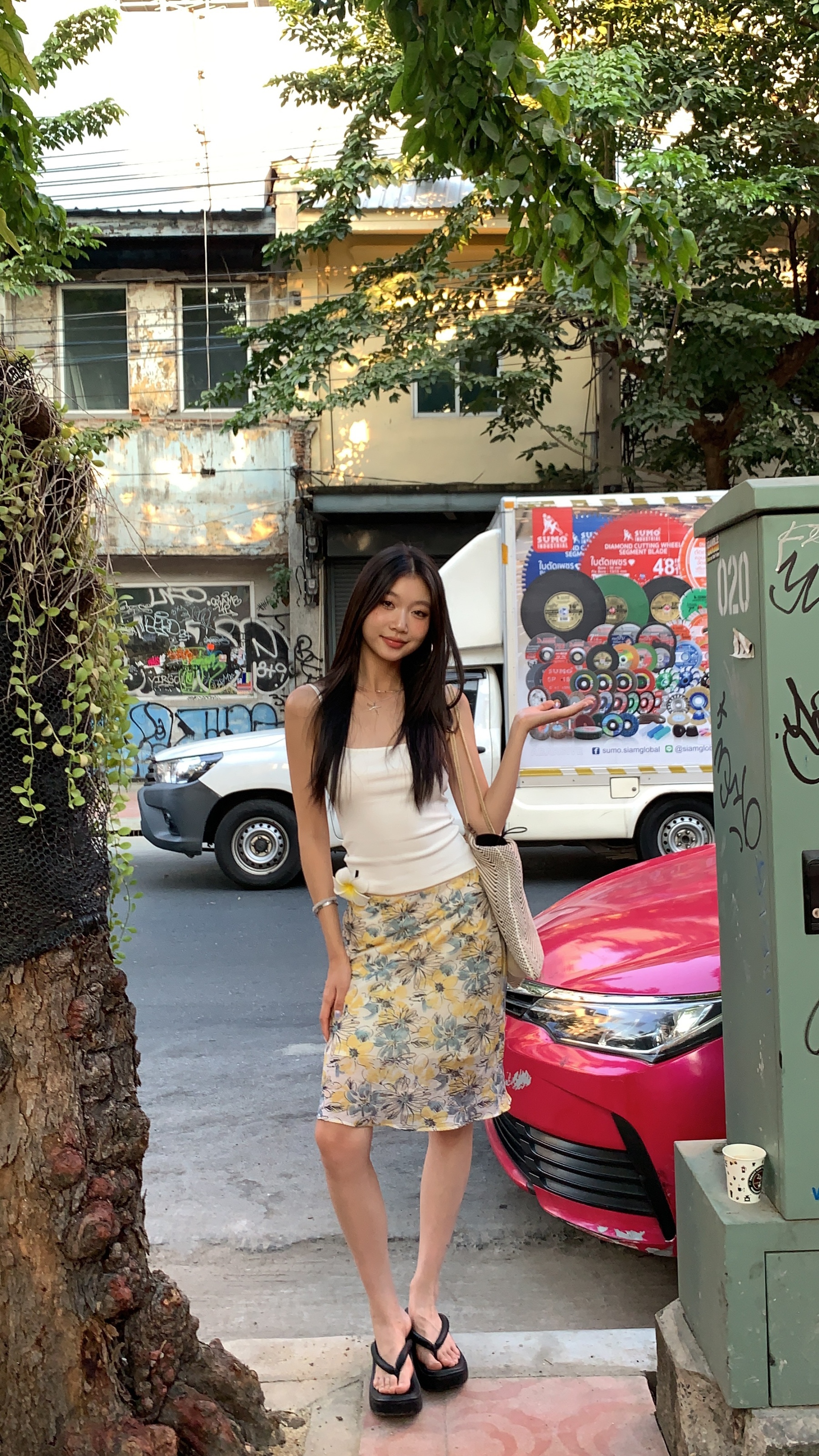 Mid-length skirt with ruffled edge design and multi-colored floral print