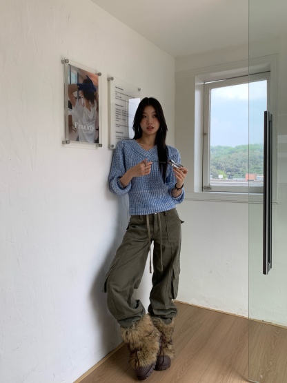 Vintage low-rise cargo pants with multiple pockets and a wide, straight leg.