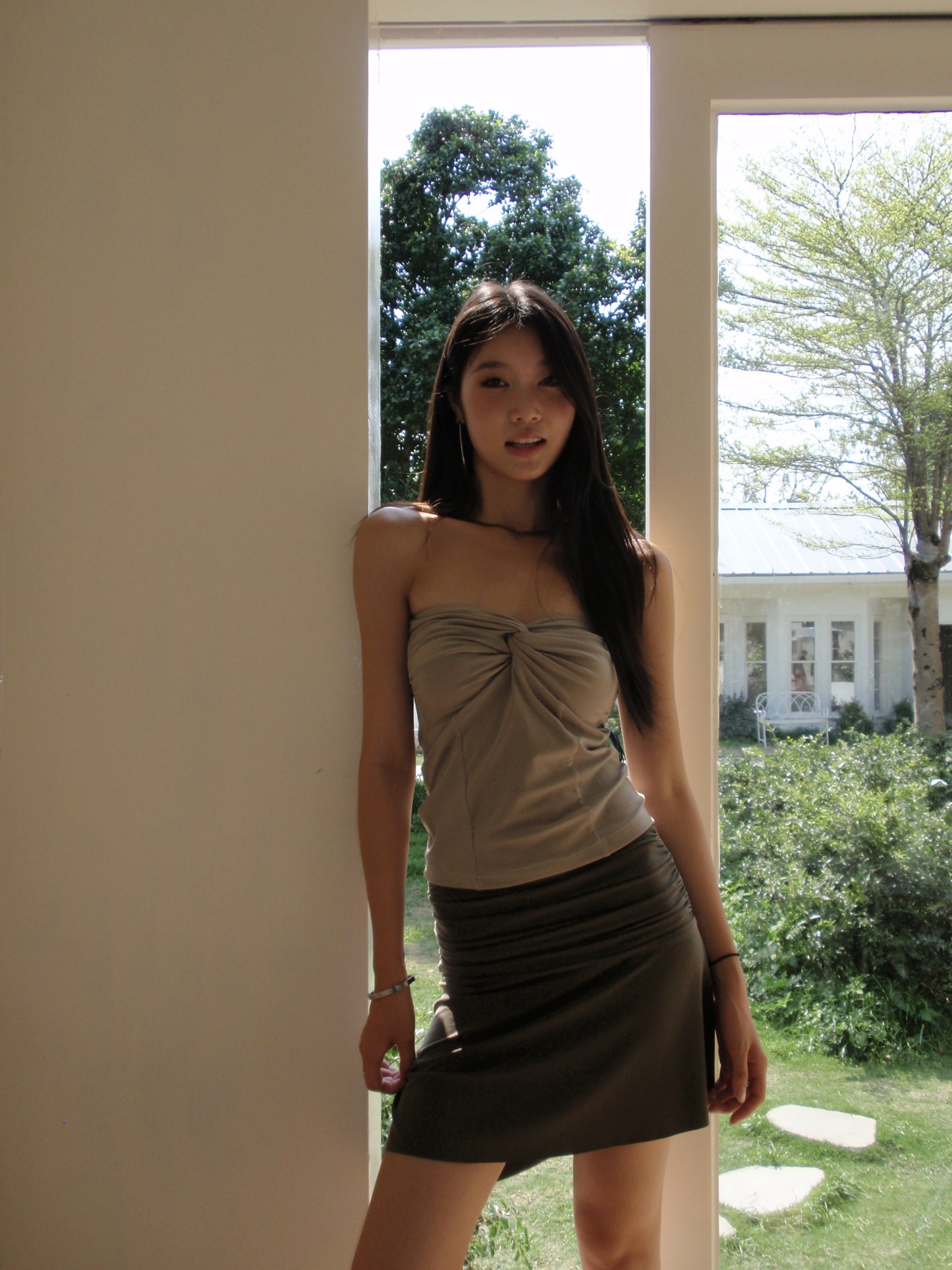 Mid-length, fitted skirt with asymmetrical design.