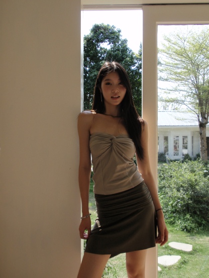 Mid-length, fitted skirt with asymmetrical design.