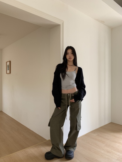 Vintage low-rise cargo pants with multiple pockets and a wide, straight leg.