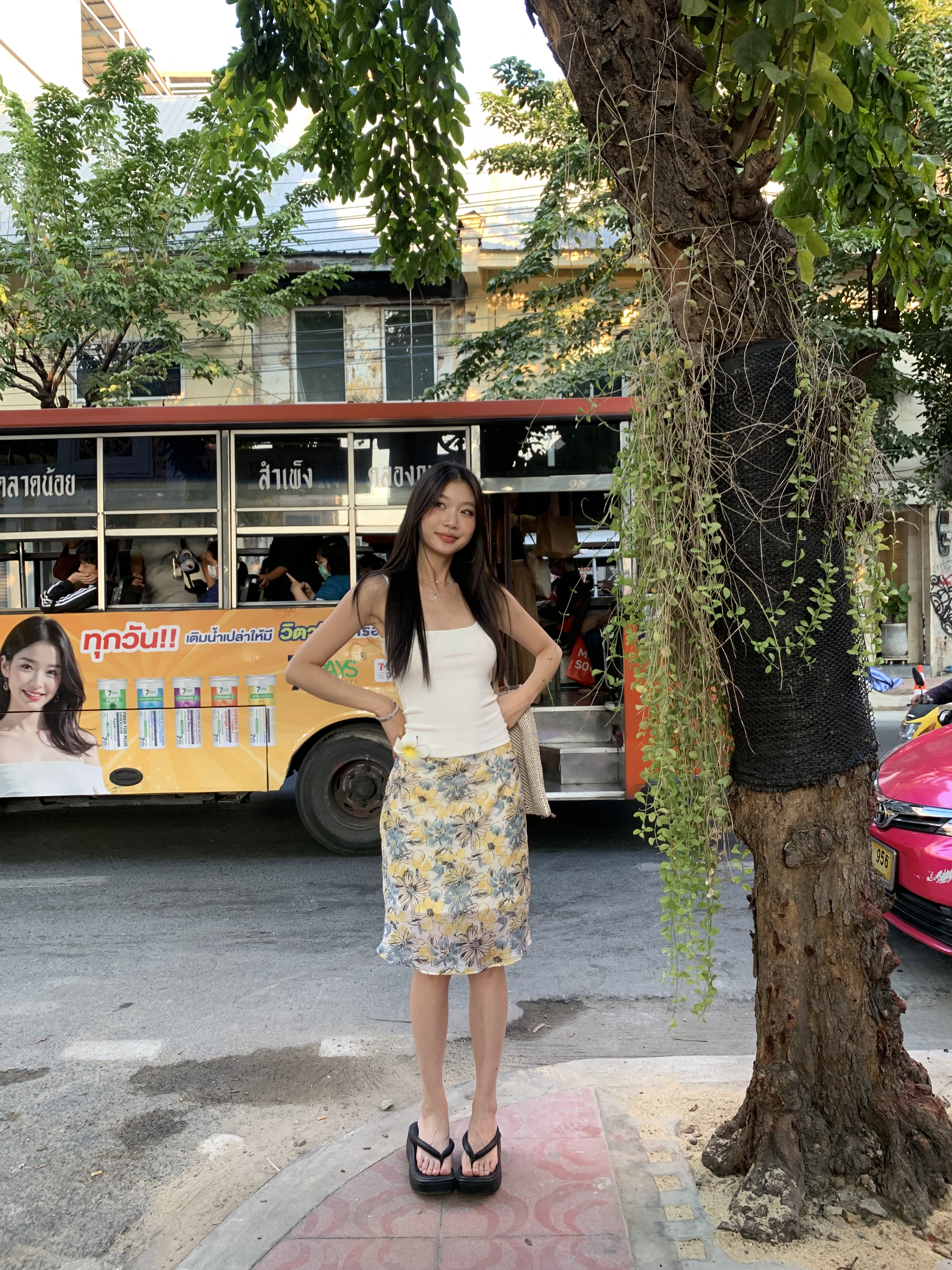 Mid-length skirt with ruffled edge design and multi-colored floral print